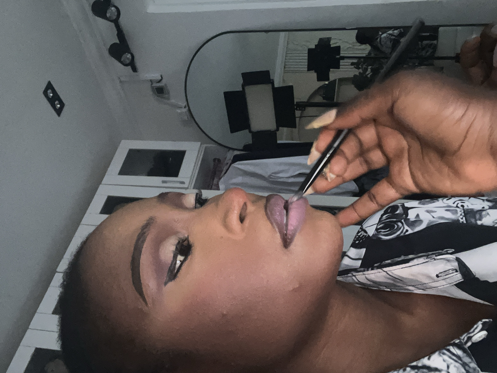 Chill afternoon in Abuja: makeup, selfies, and a white dog