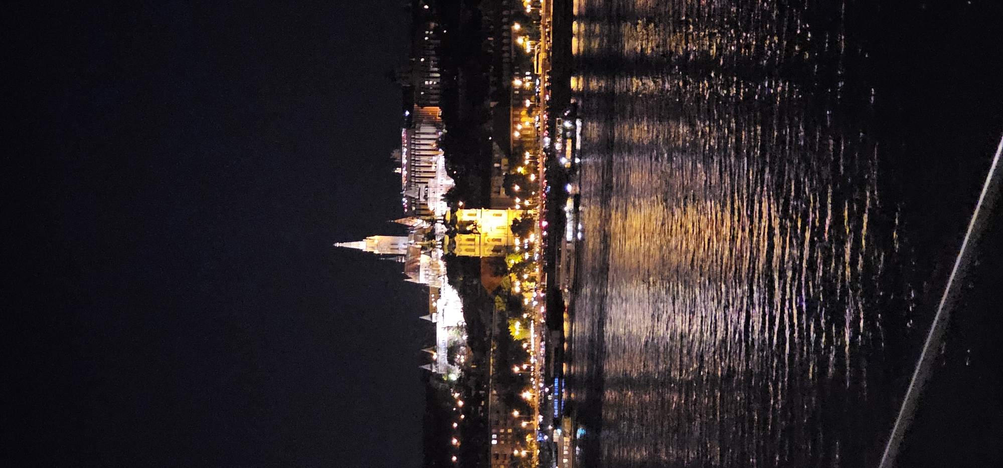 Danube River at night, Buda Castle District glowing behind it