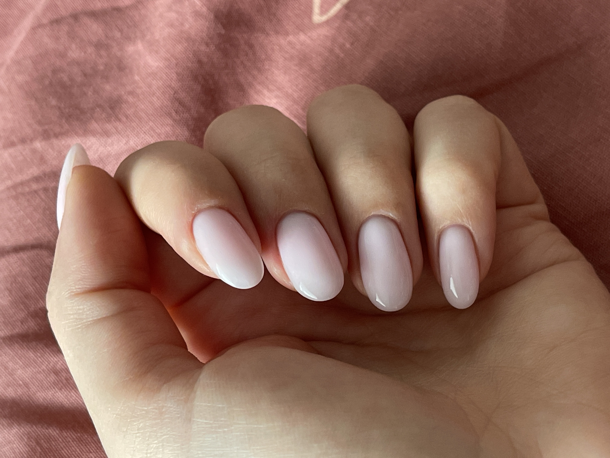 Manicured pink nails photographed in Riga