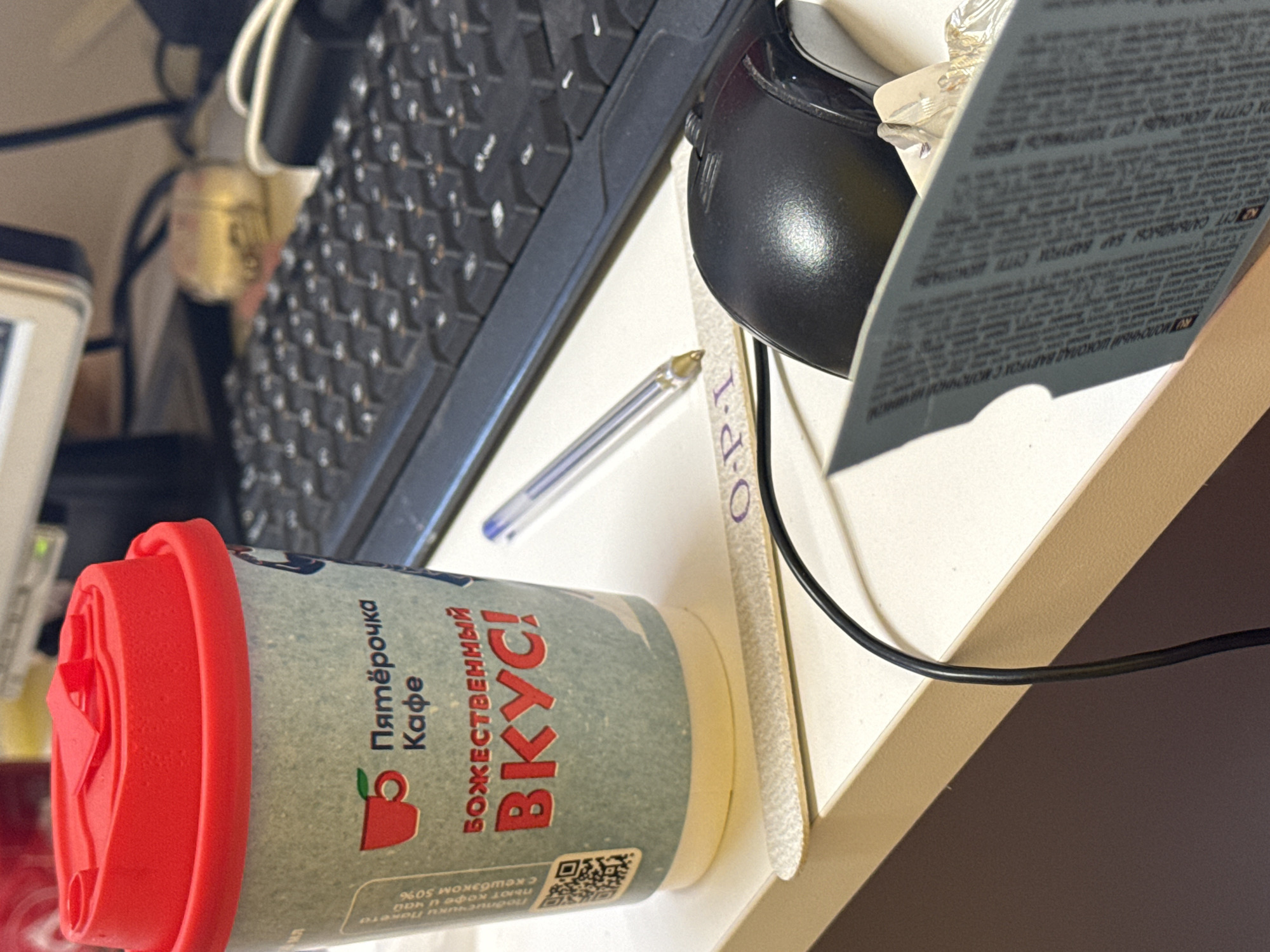 Office desk spotted with scattered raspberries among work supplies