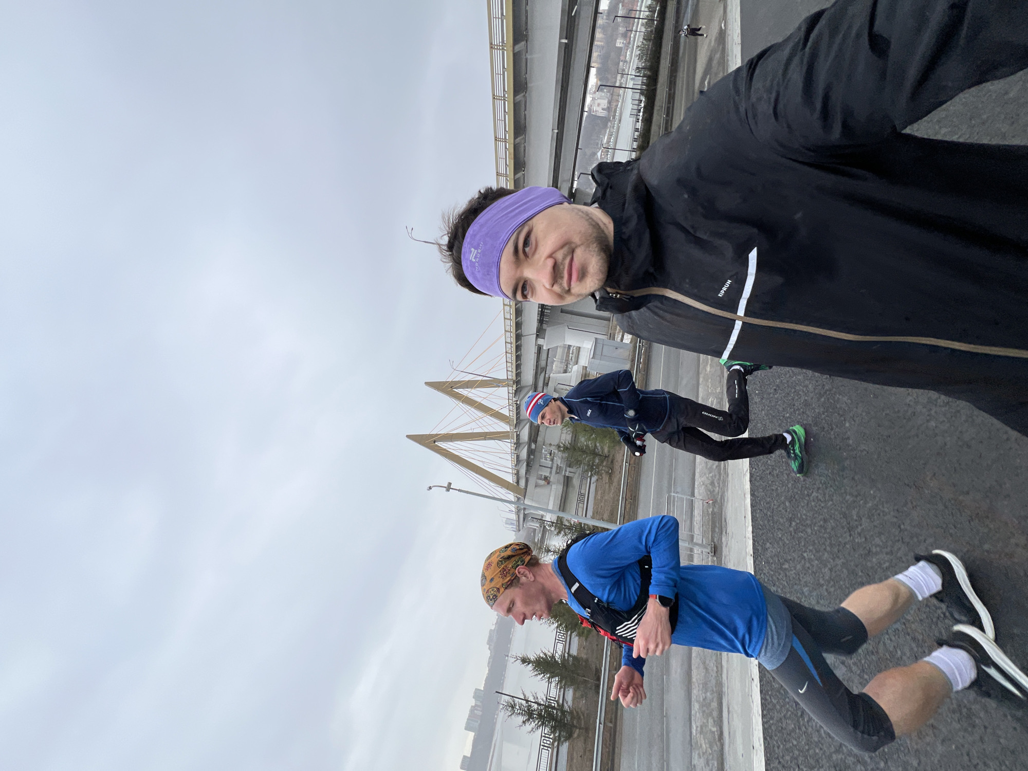 Morning runners take group selfie on snowy Kazan walkway