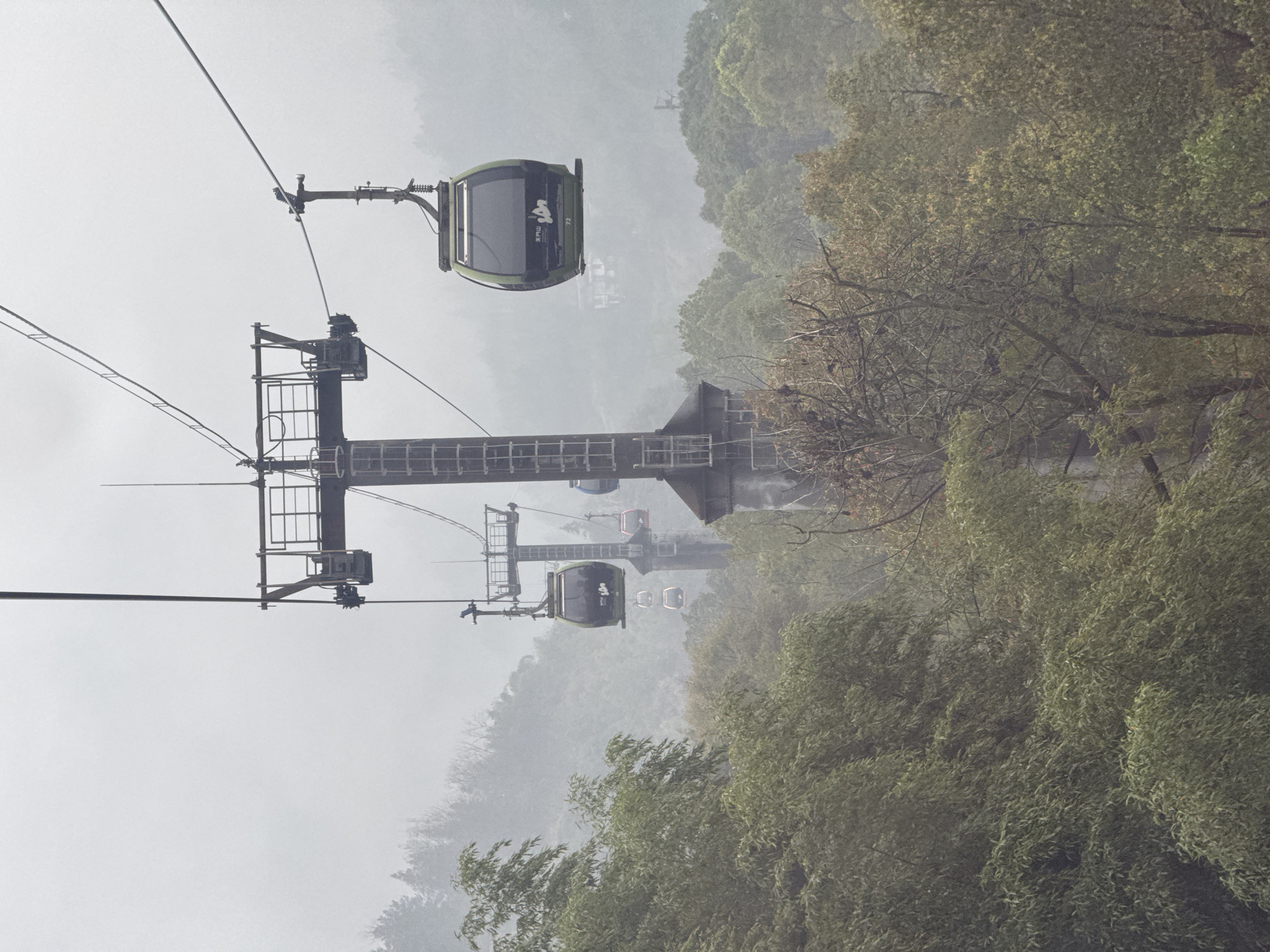 Cable cars operate through misty conditions at Tianmen Mountain