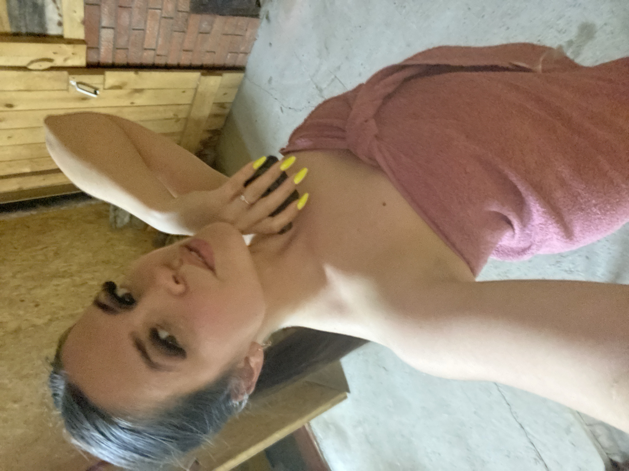 Woman photographed in pink towel in Zhigalki interior space