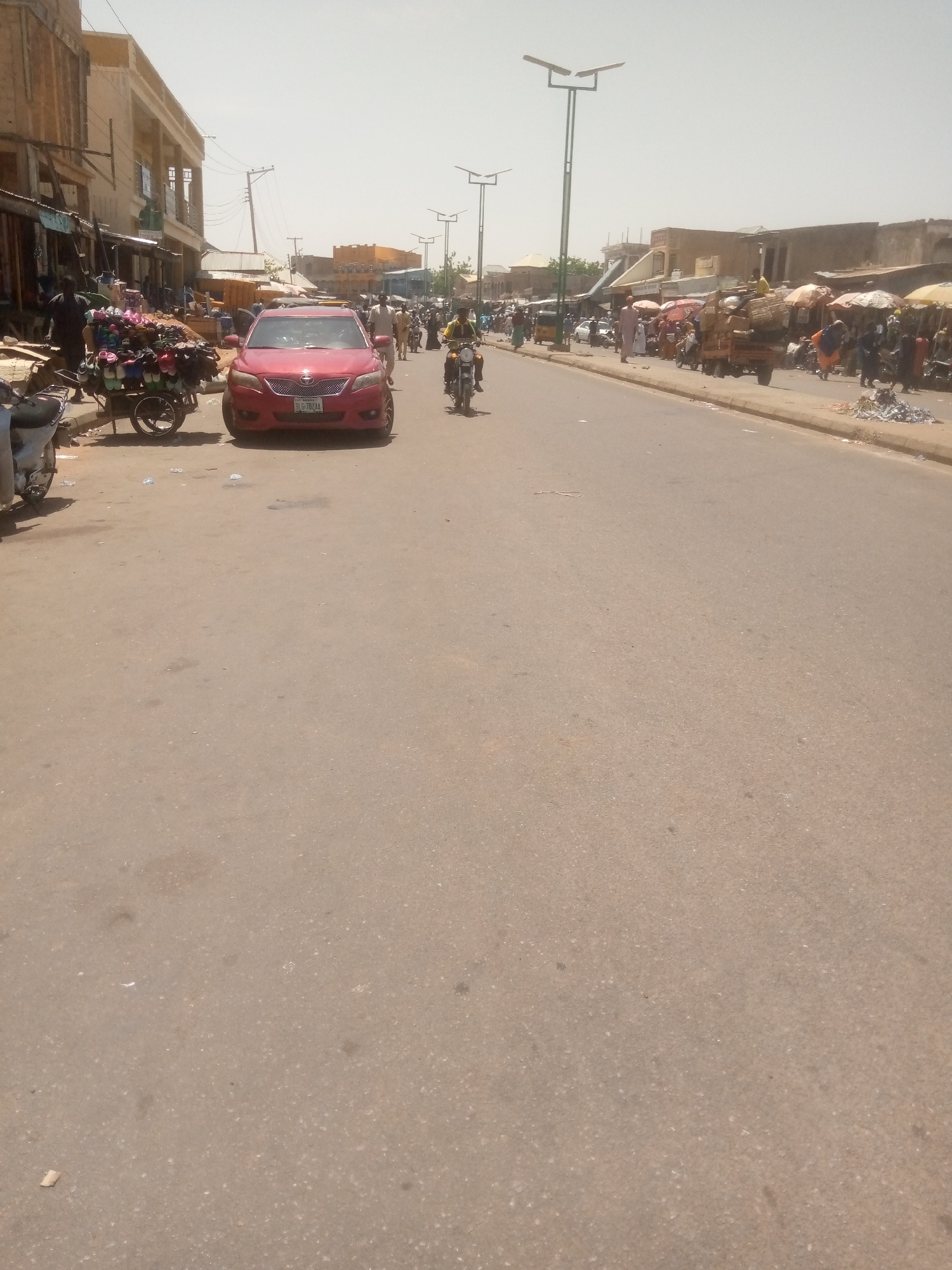 Midday street life documented in Arawa, Nigeria commercial district