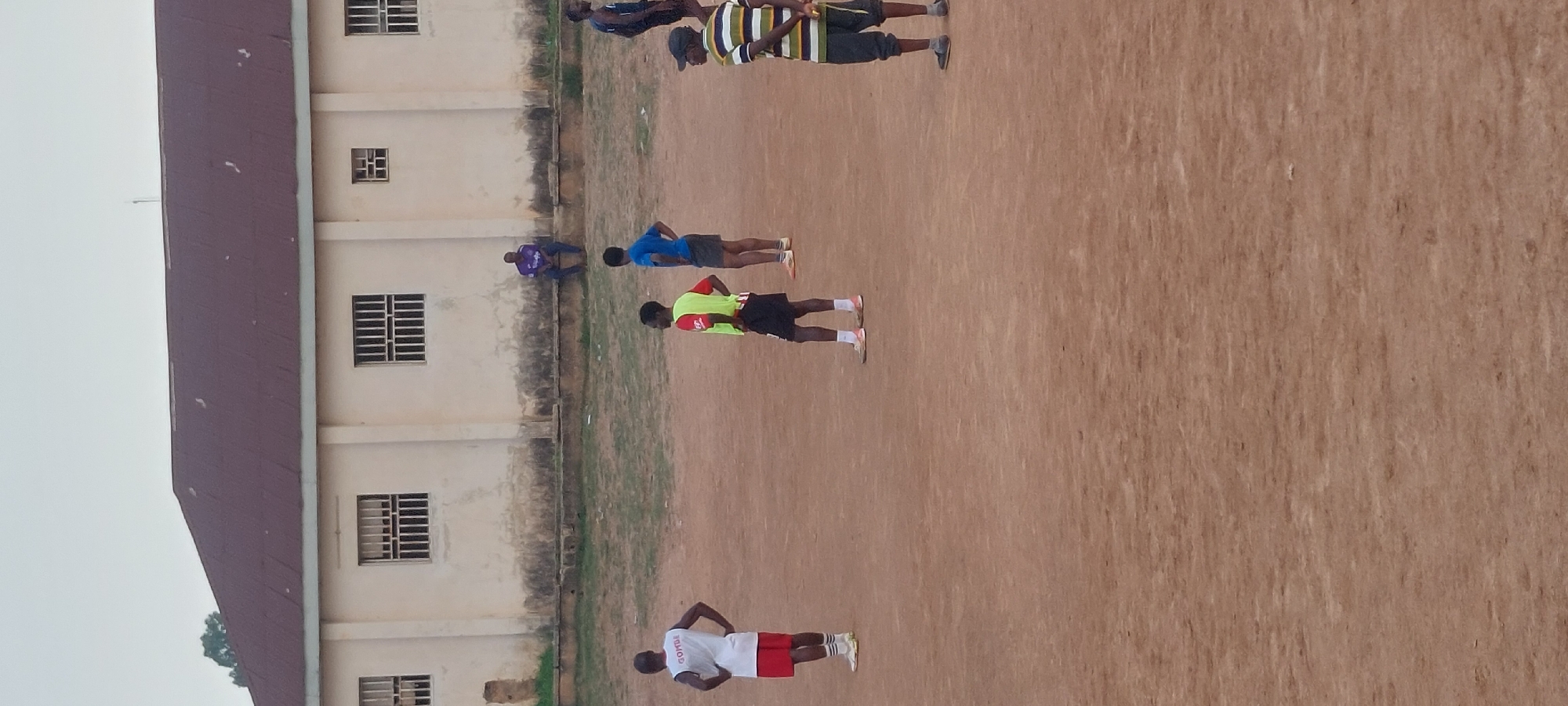 Soccer on a dusty pitch at Bukuru Stadium, Nigeria