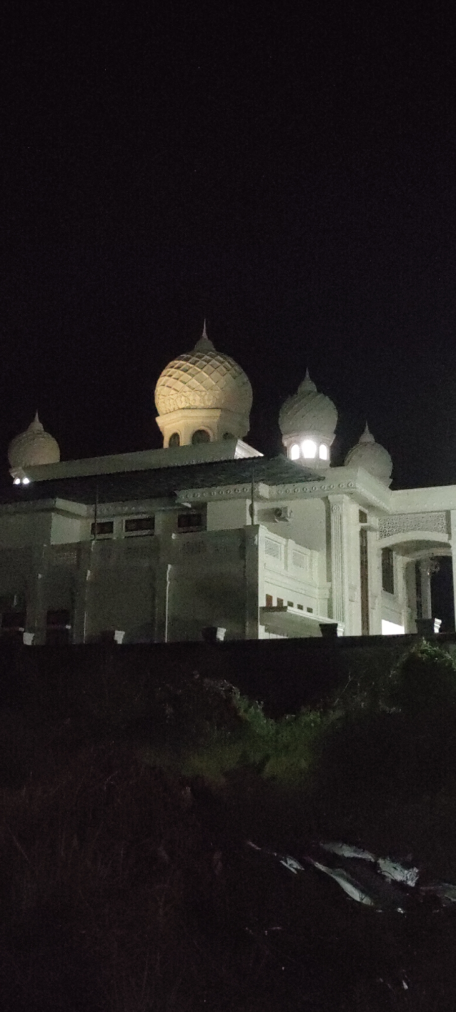 Islamic Center Mosque illuminated at night in Lhokseumawe