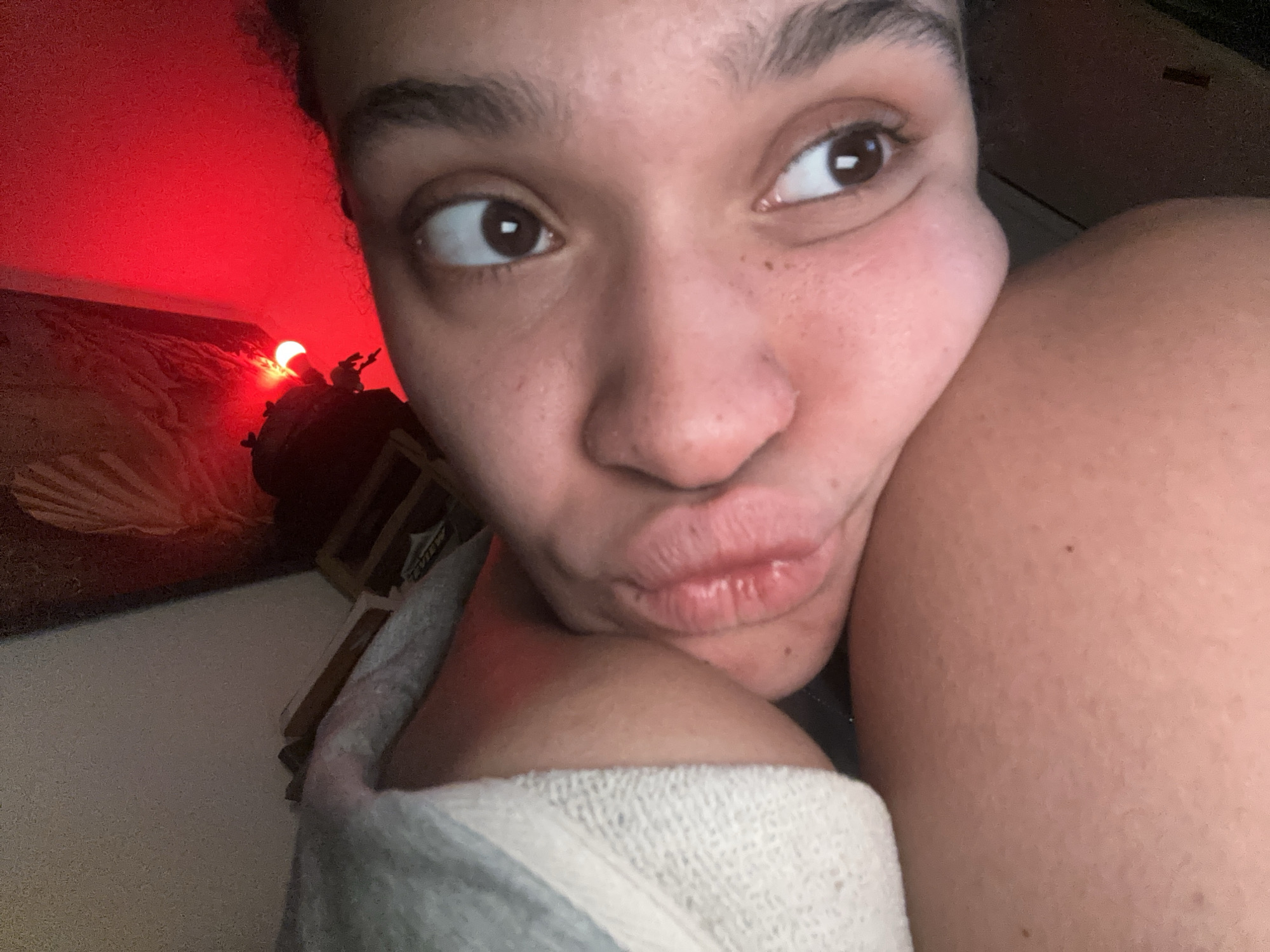 Woman takes indoor selfie with towel in London