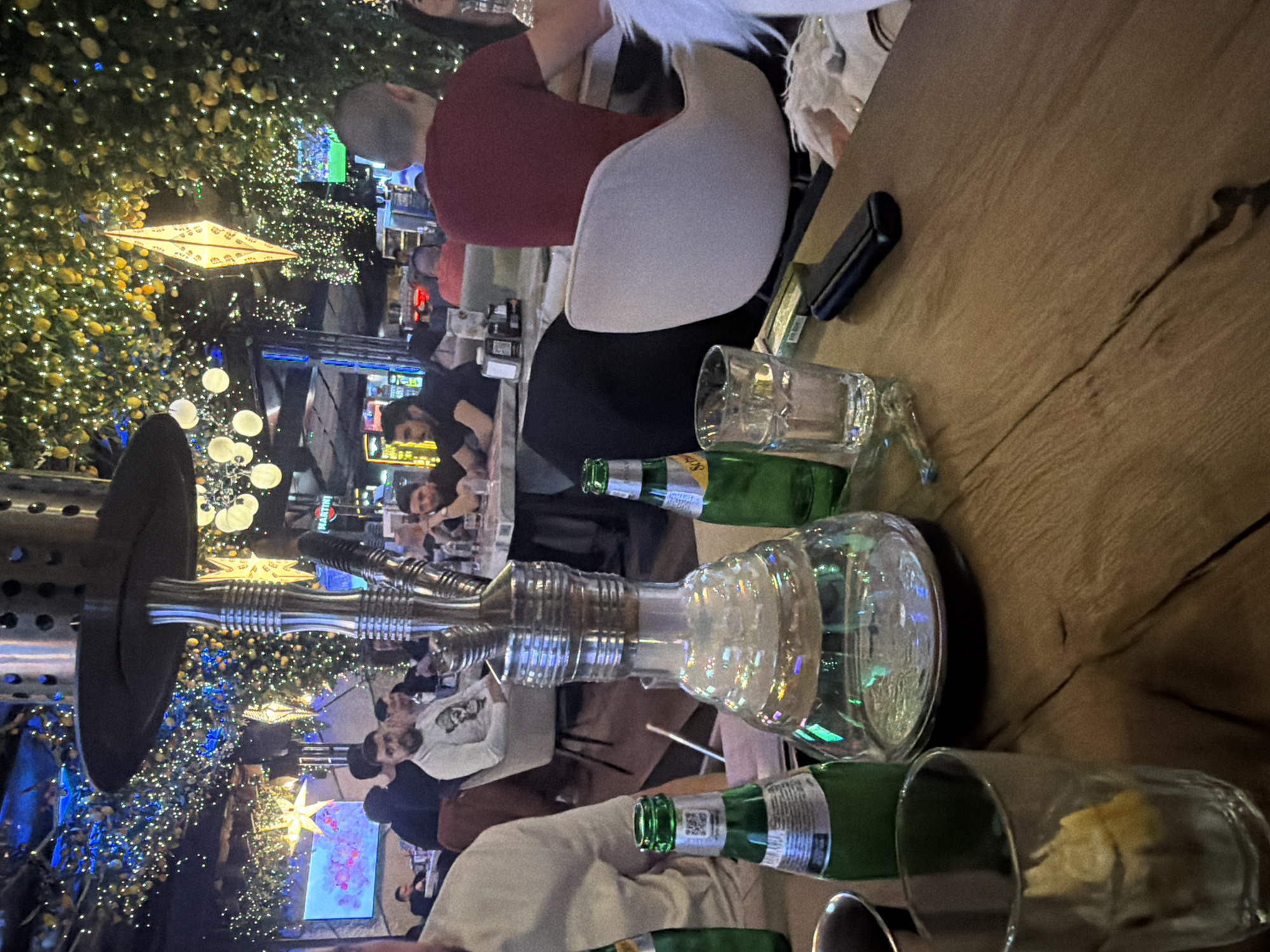 Evening dining scene documented at Sofia establishment with spring blooms