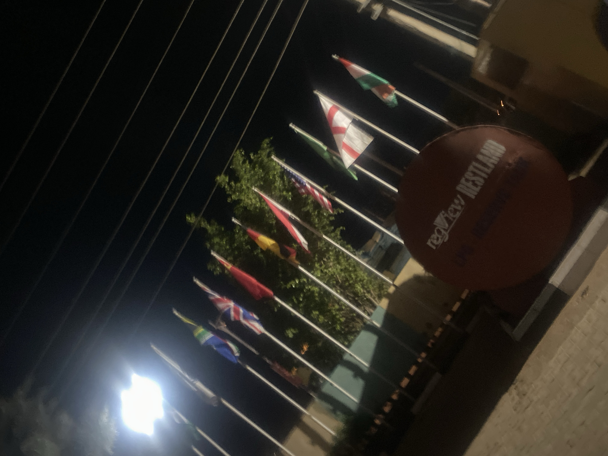 Evening scenes captured in Television, Nigeria show flags and personalized bottle