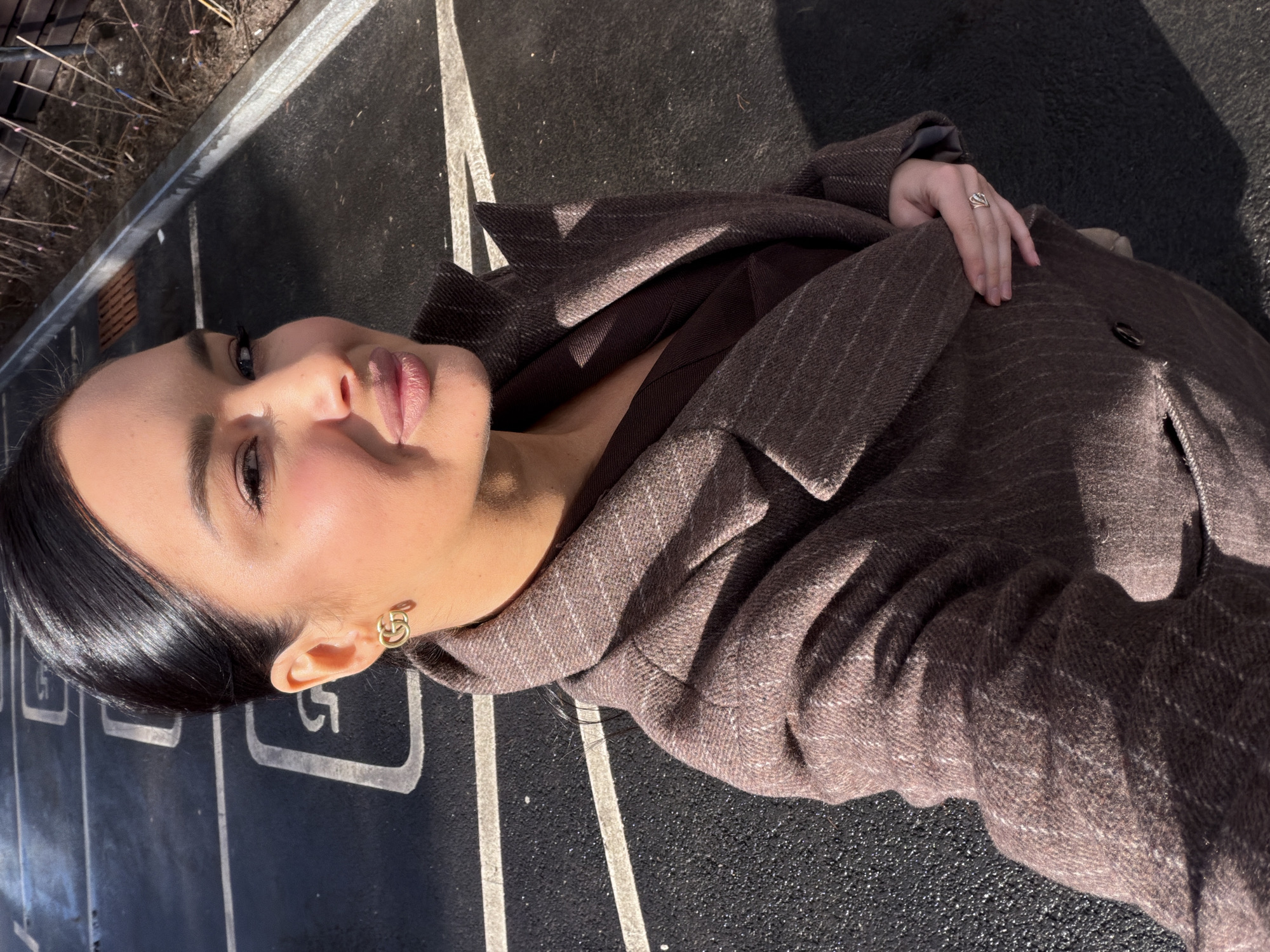 Woman in brown jacket photographed outdoors in Zhukovka, Russia