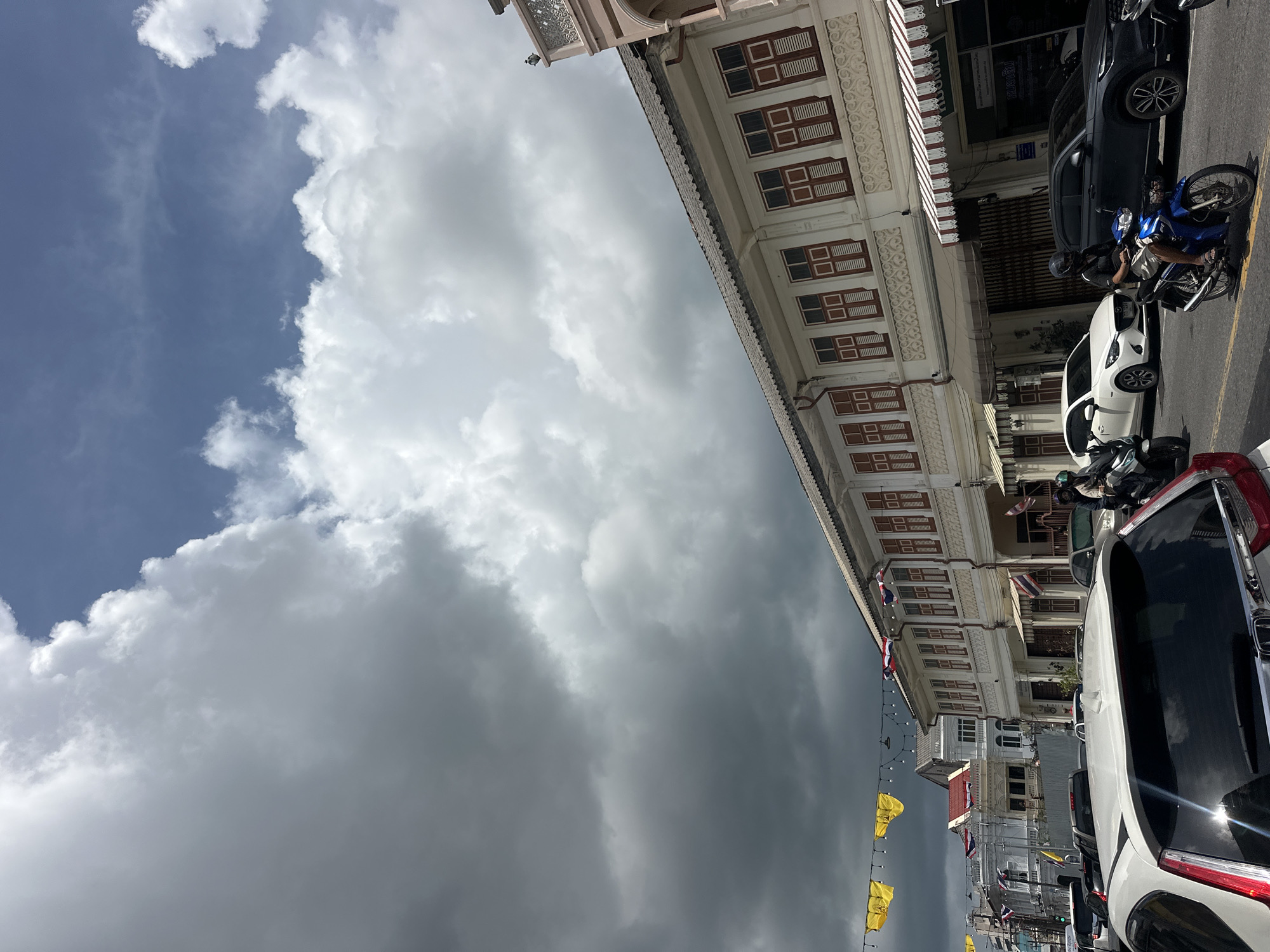 Old town Phuket shophouses under a stormy sky