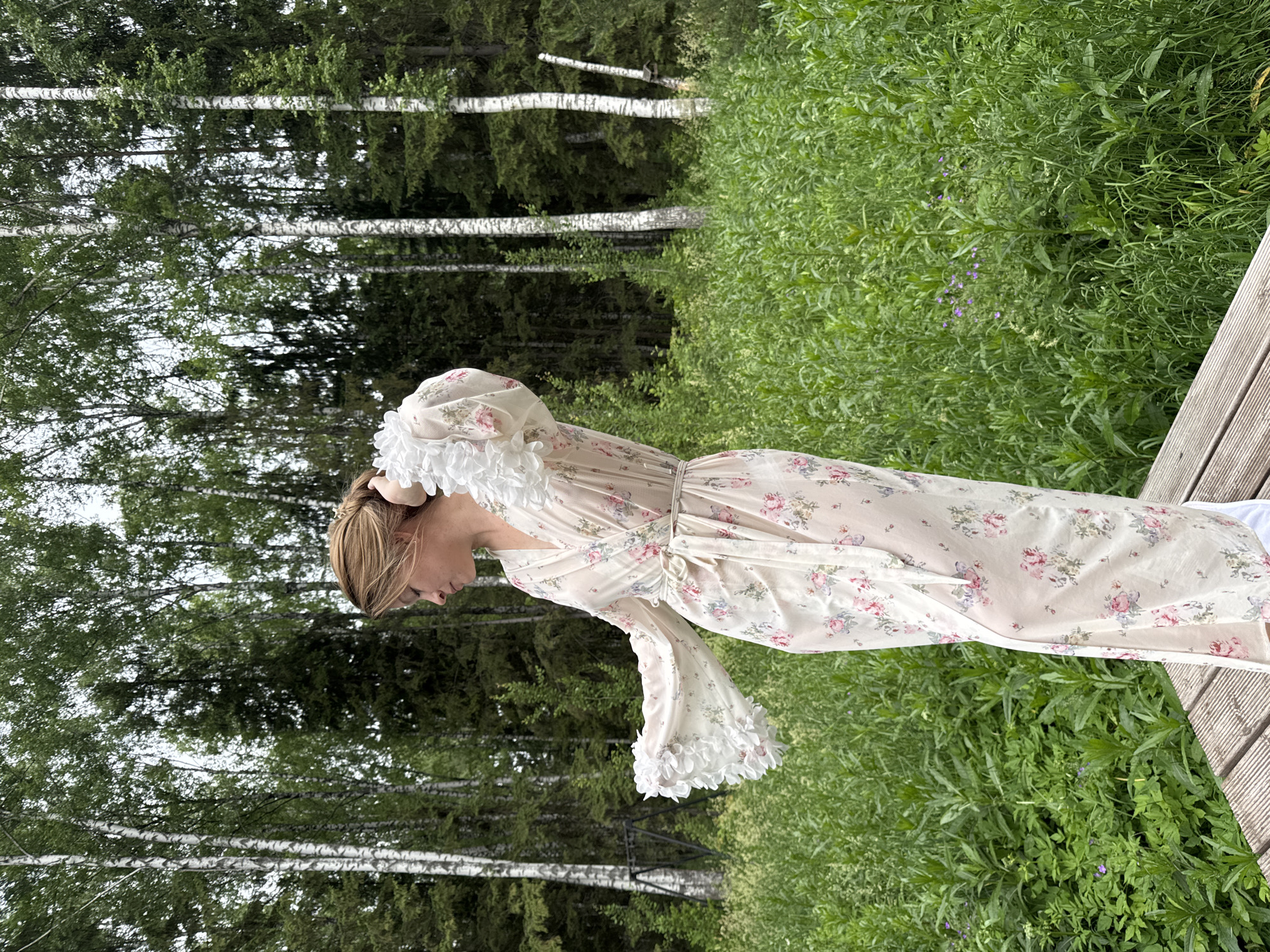 Woman photographs morning robe session in rural Russia