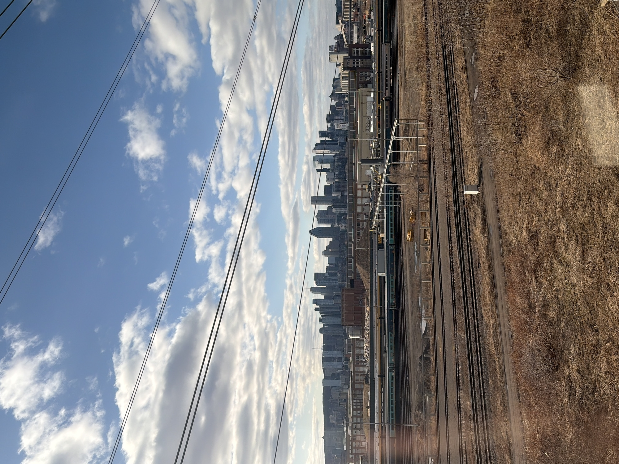 Montreal cityscape photographed from railway tracks area