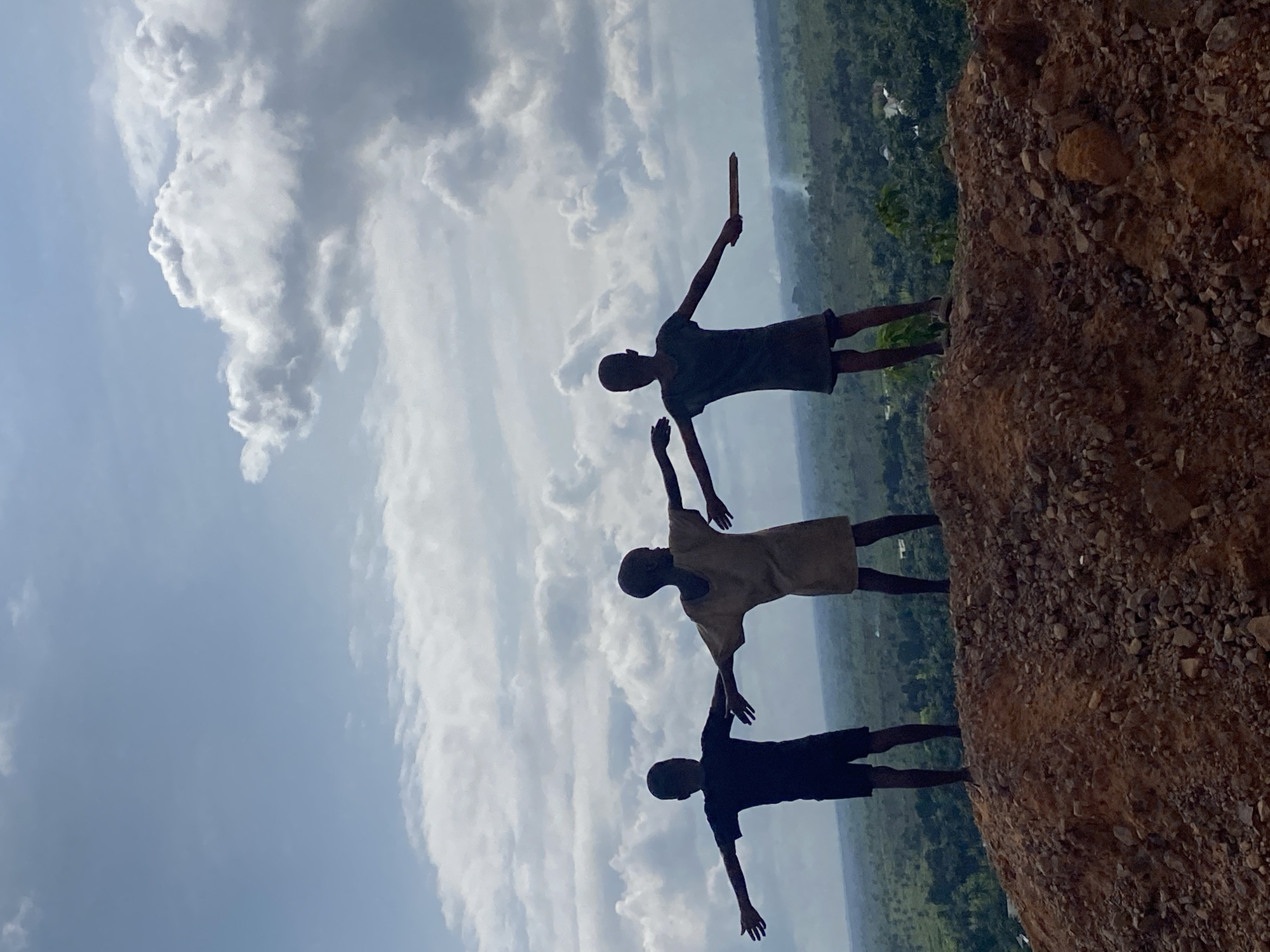Standing on a ridge overlooking Ufueseni's green valley