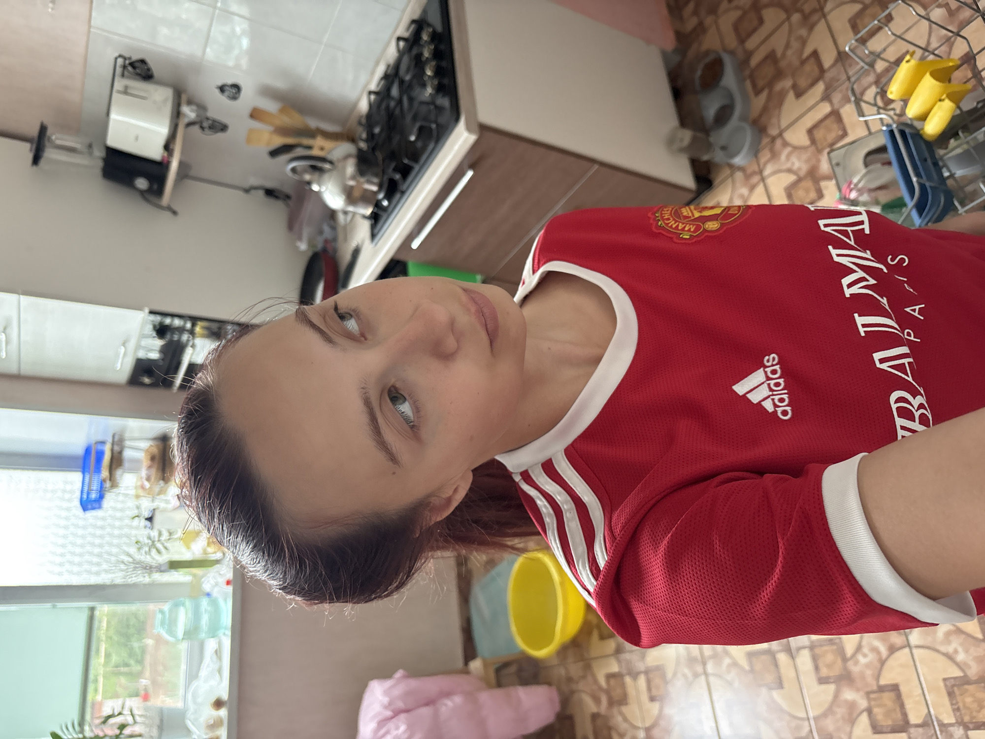 Woman in Manchester United jersey photographed in Прикамский, Russia