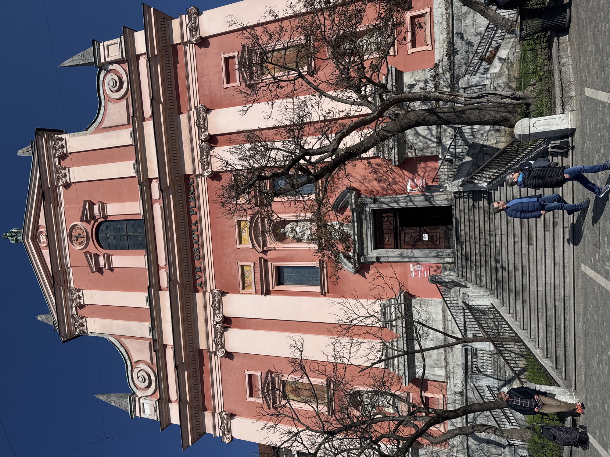 Tourist documents sunny morning tour of central Ljubljana landmarks