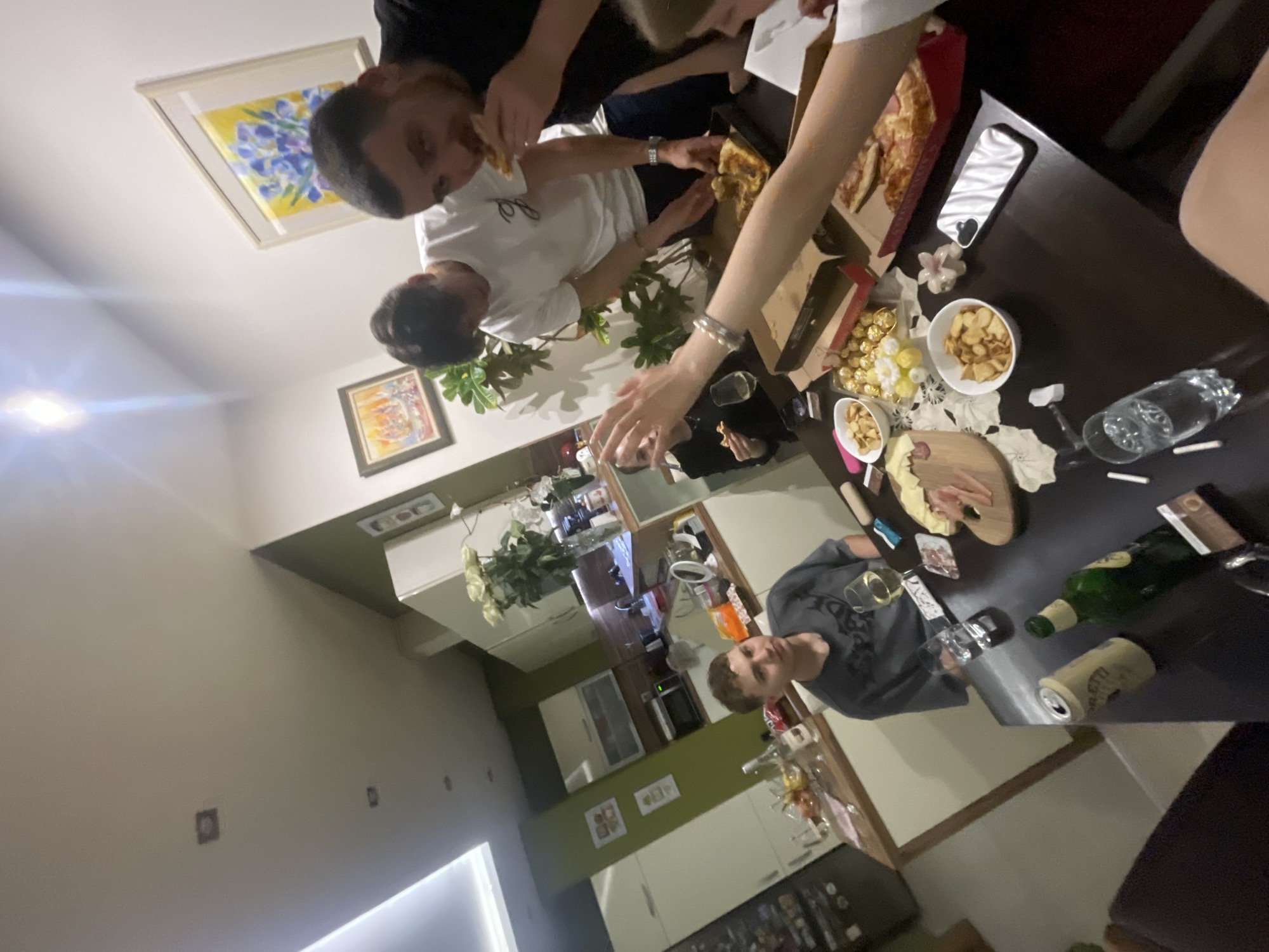 Indoor scenes captured in Varna: gathering, skateboard collection, woman with cat