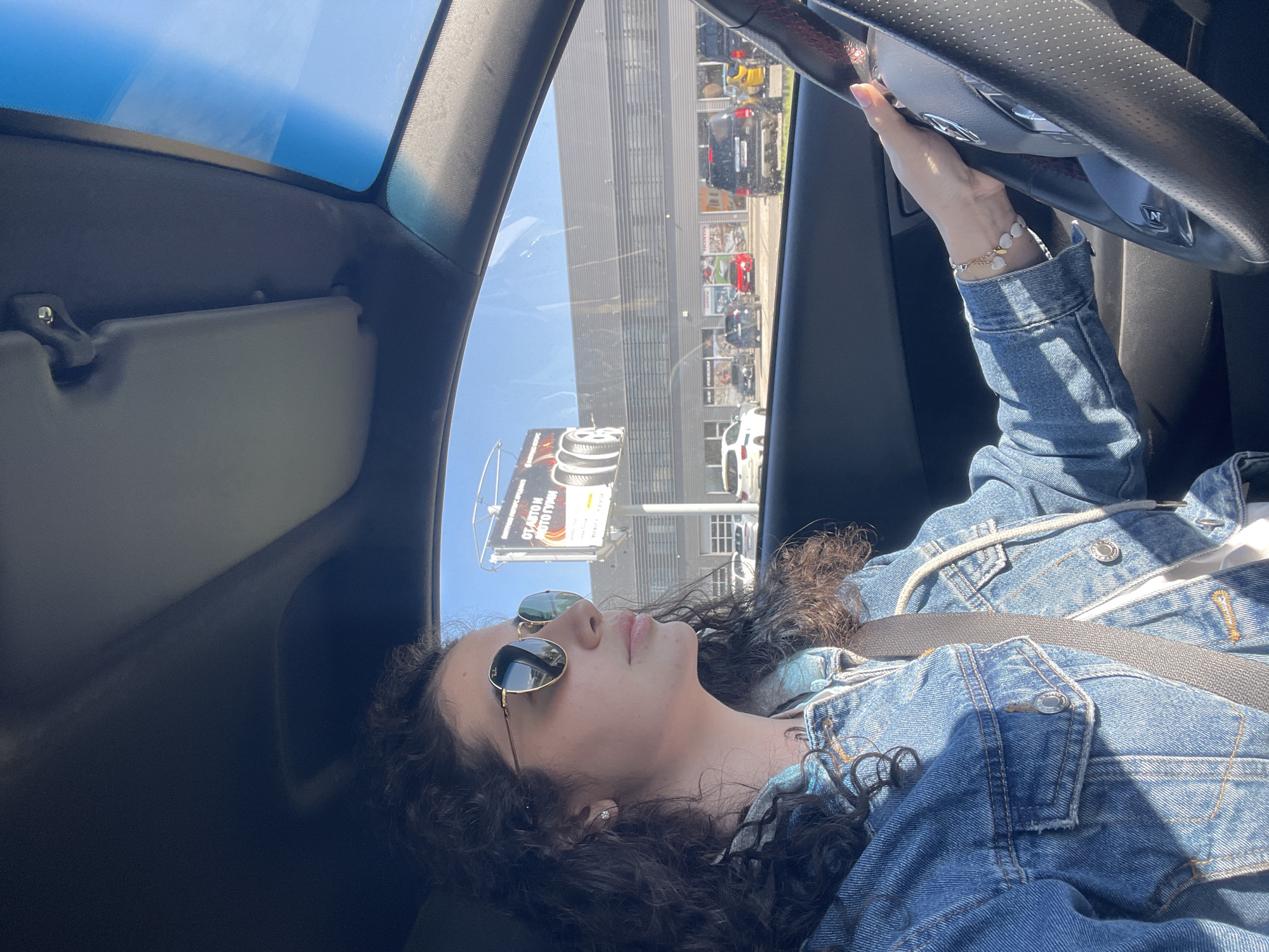 Woman drives highway near Sofia under clear skies