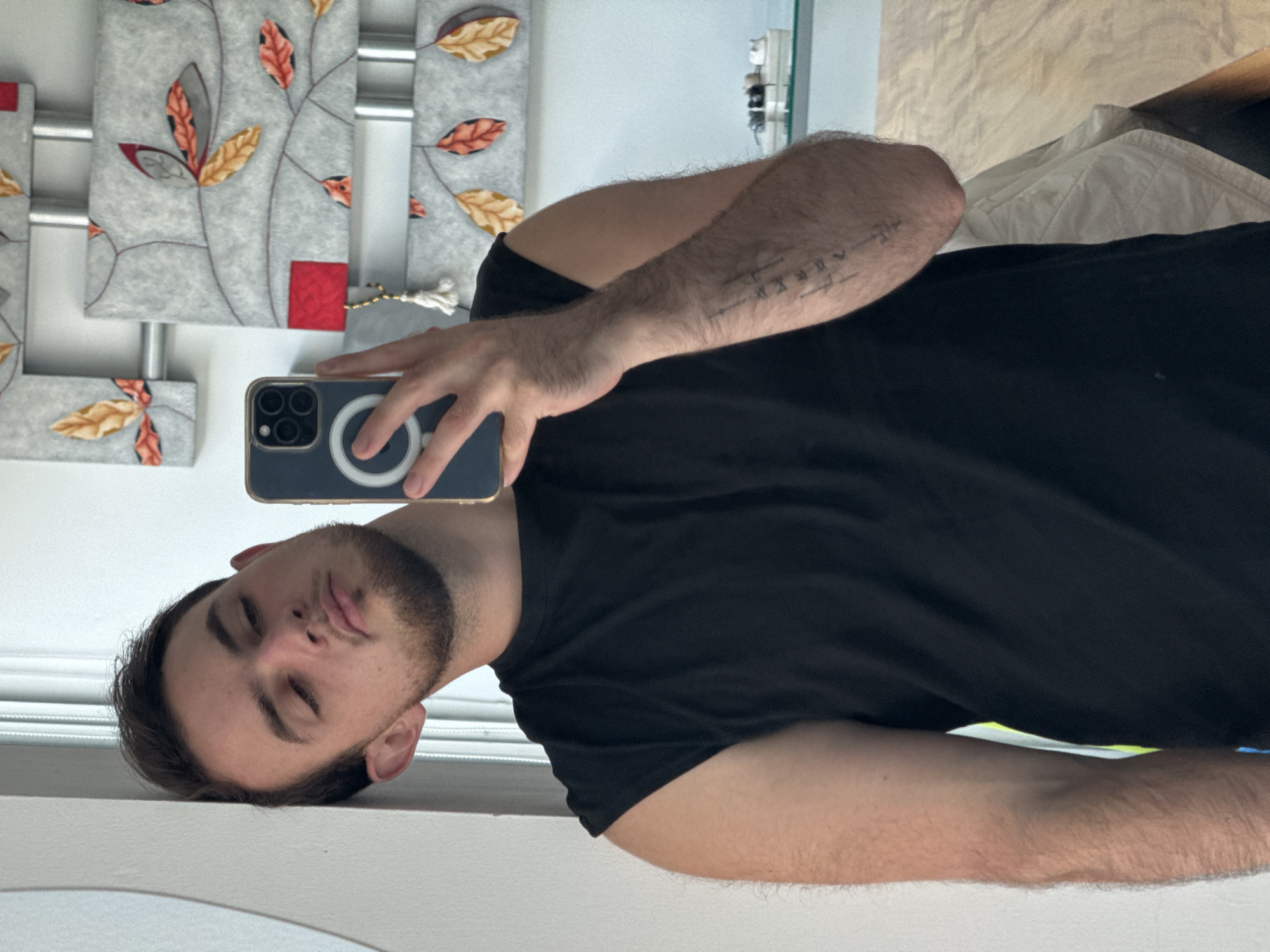 Man Takes Mirror Selfie in Mexican Bedroom