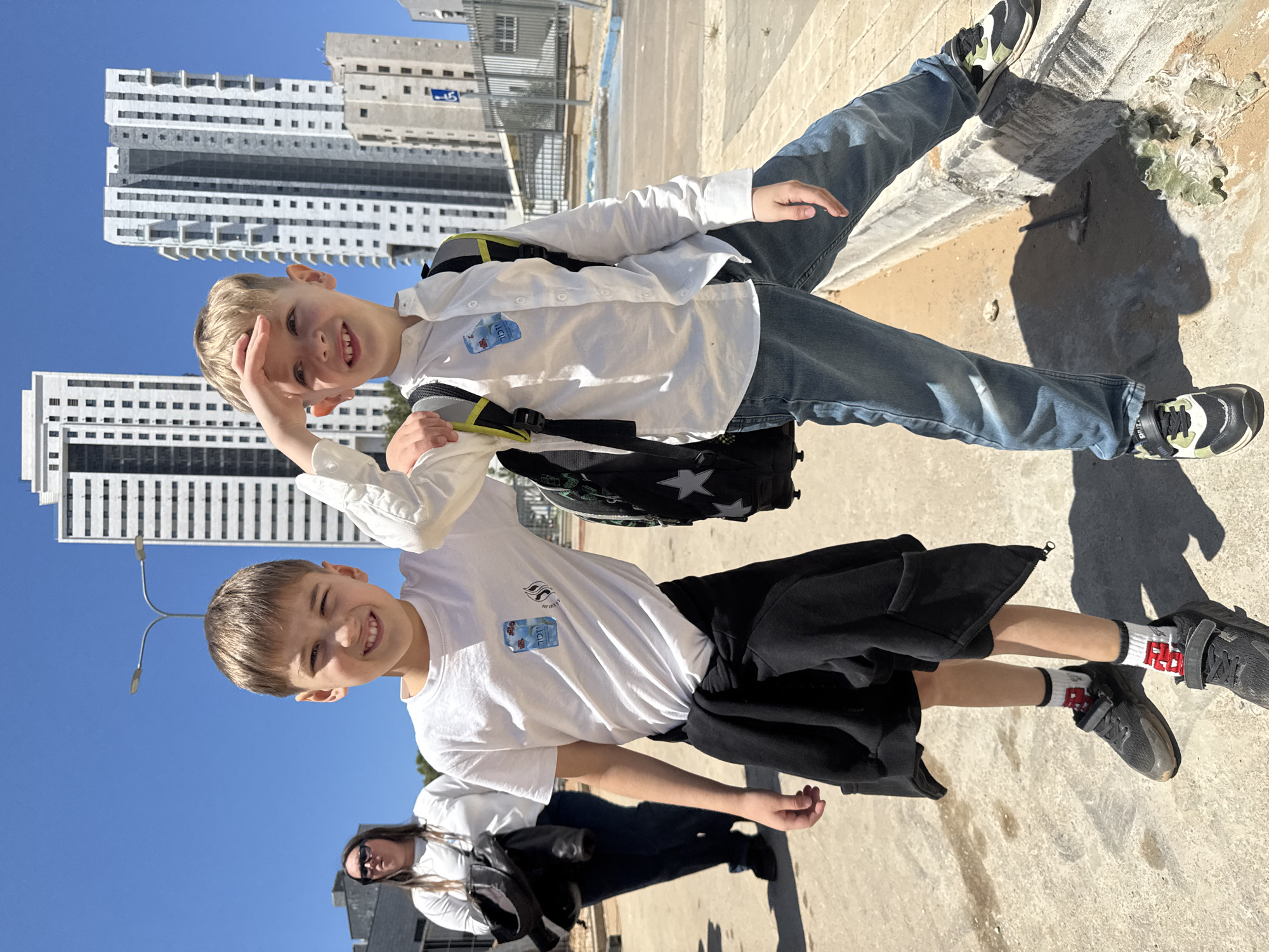 Two boys smile for camera in sunny Netanya