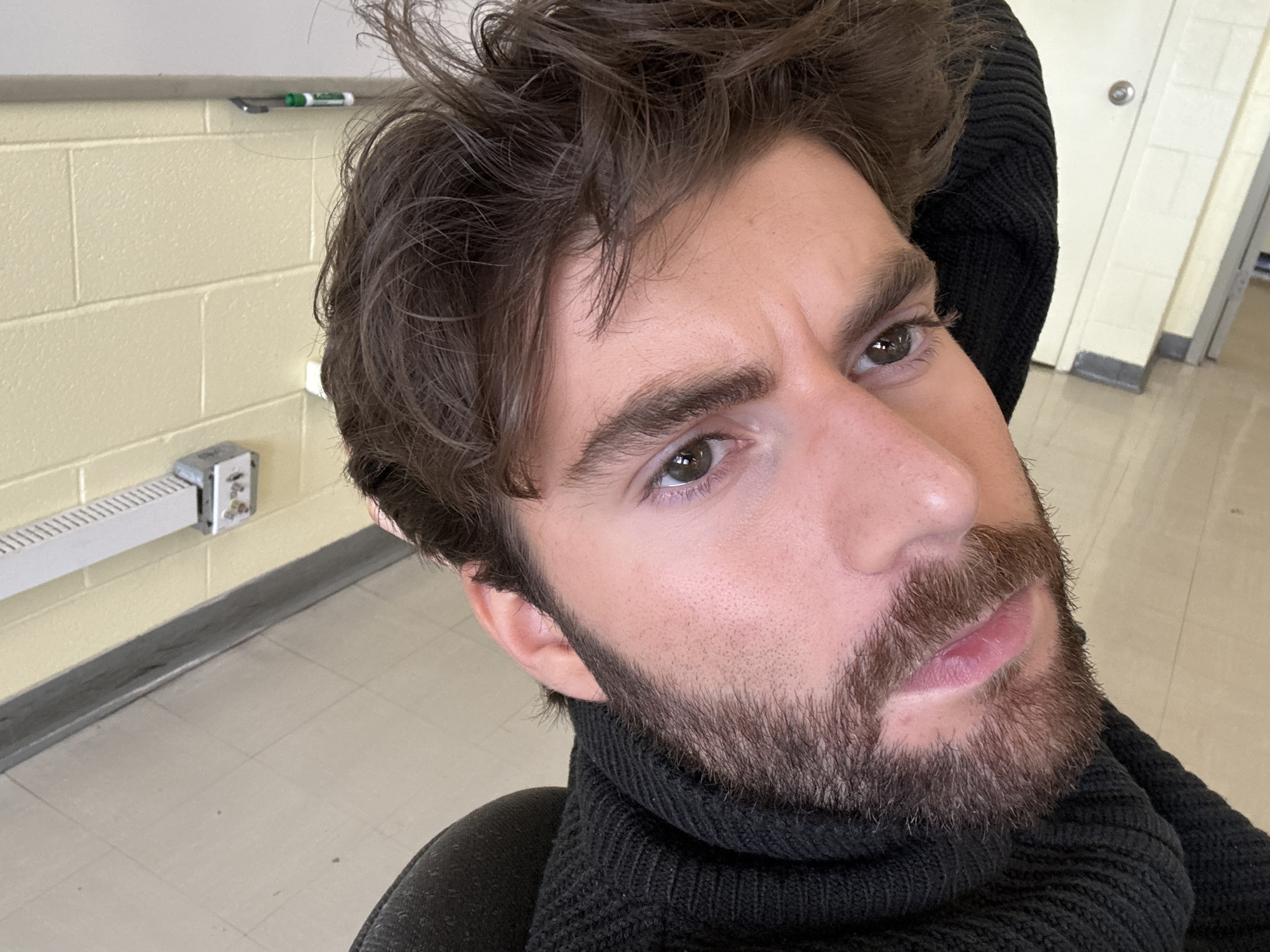 Man photographed multiple times in Montreal indoor setting