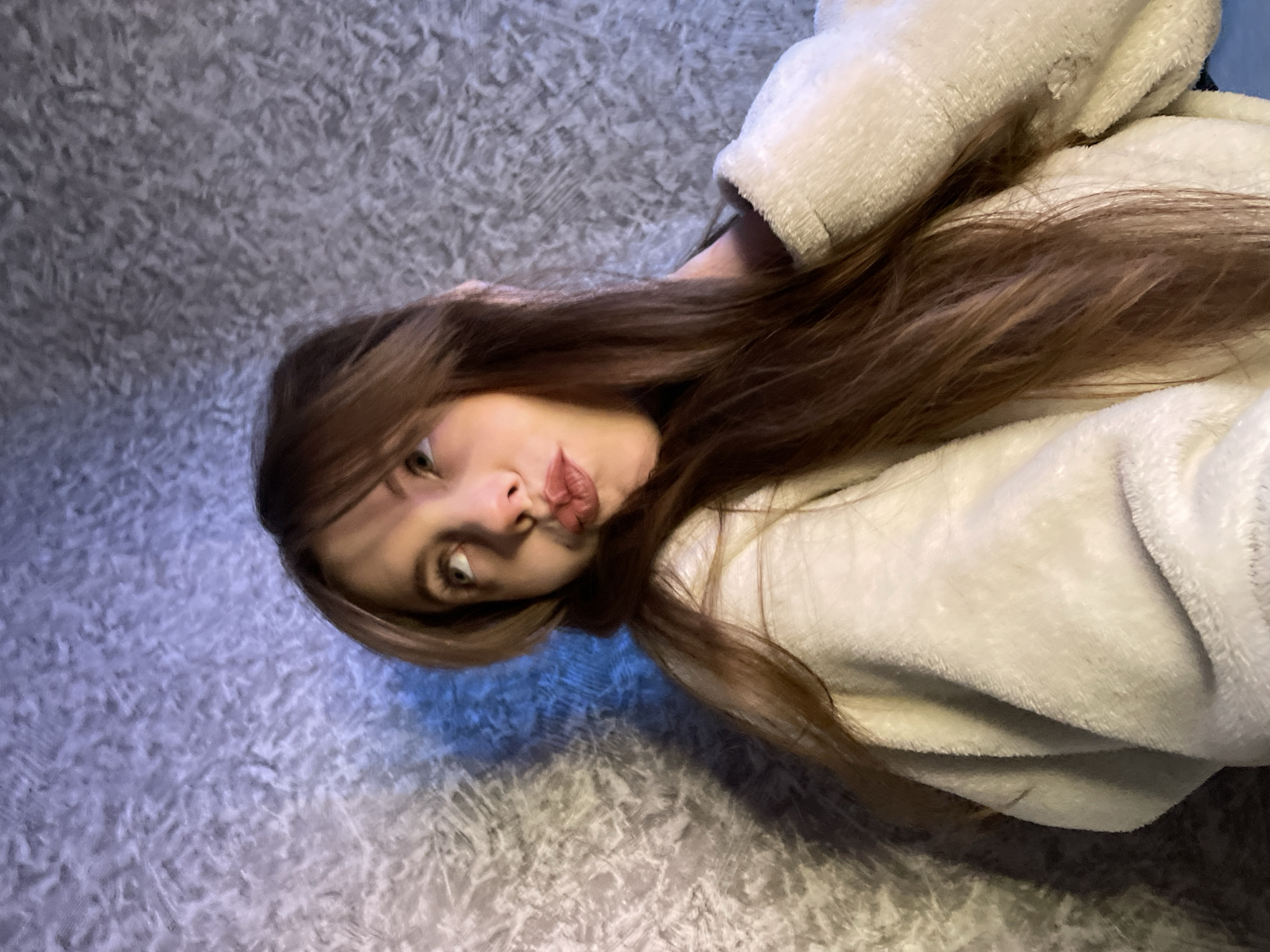 Woman observed resting on textured surface in Russian town