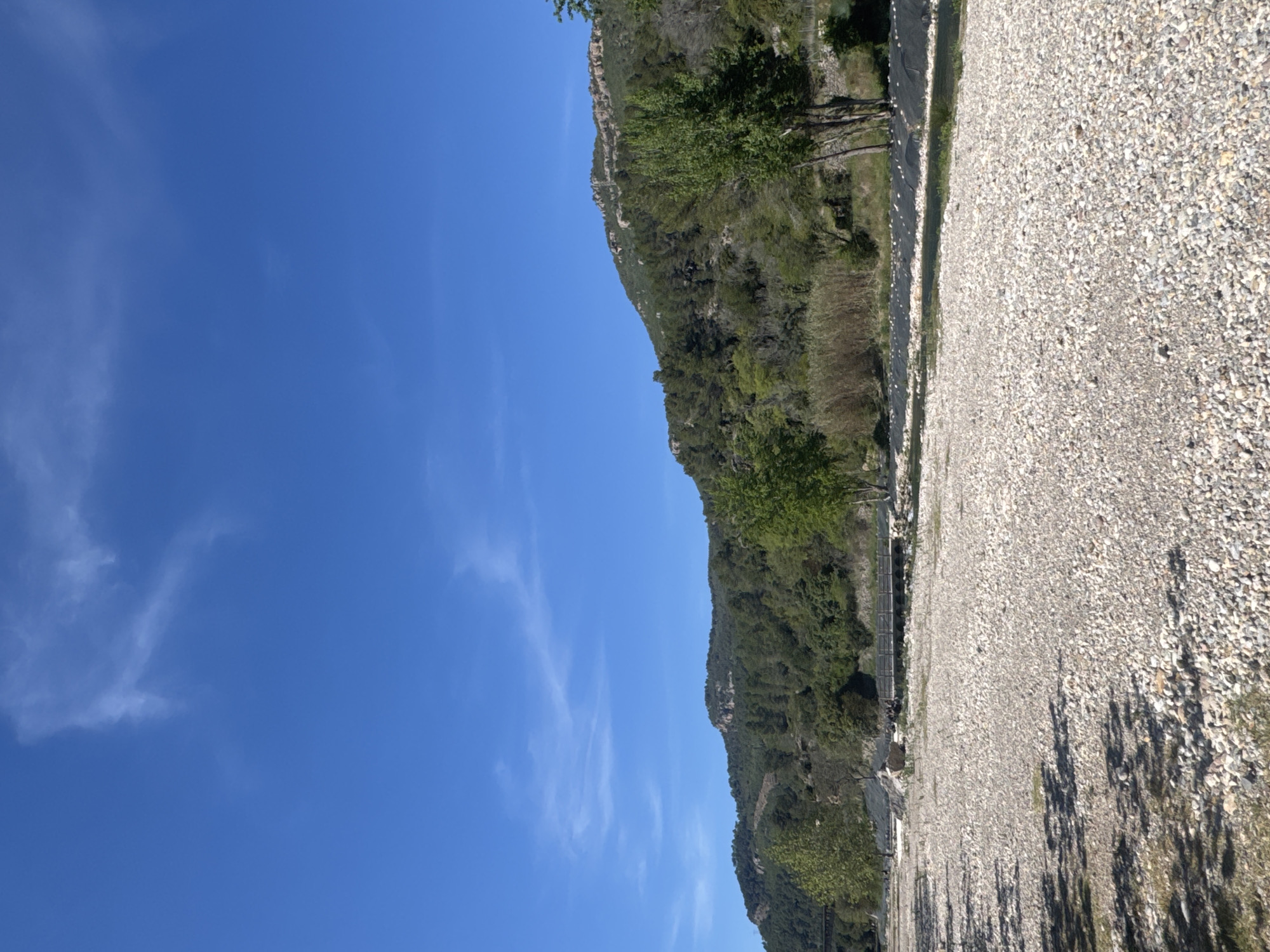 Forested hillside and gravel area observed in Montanejos, Spain