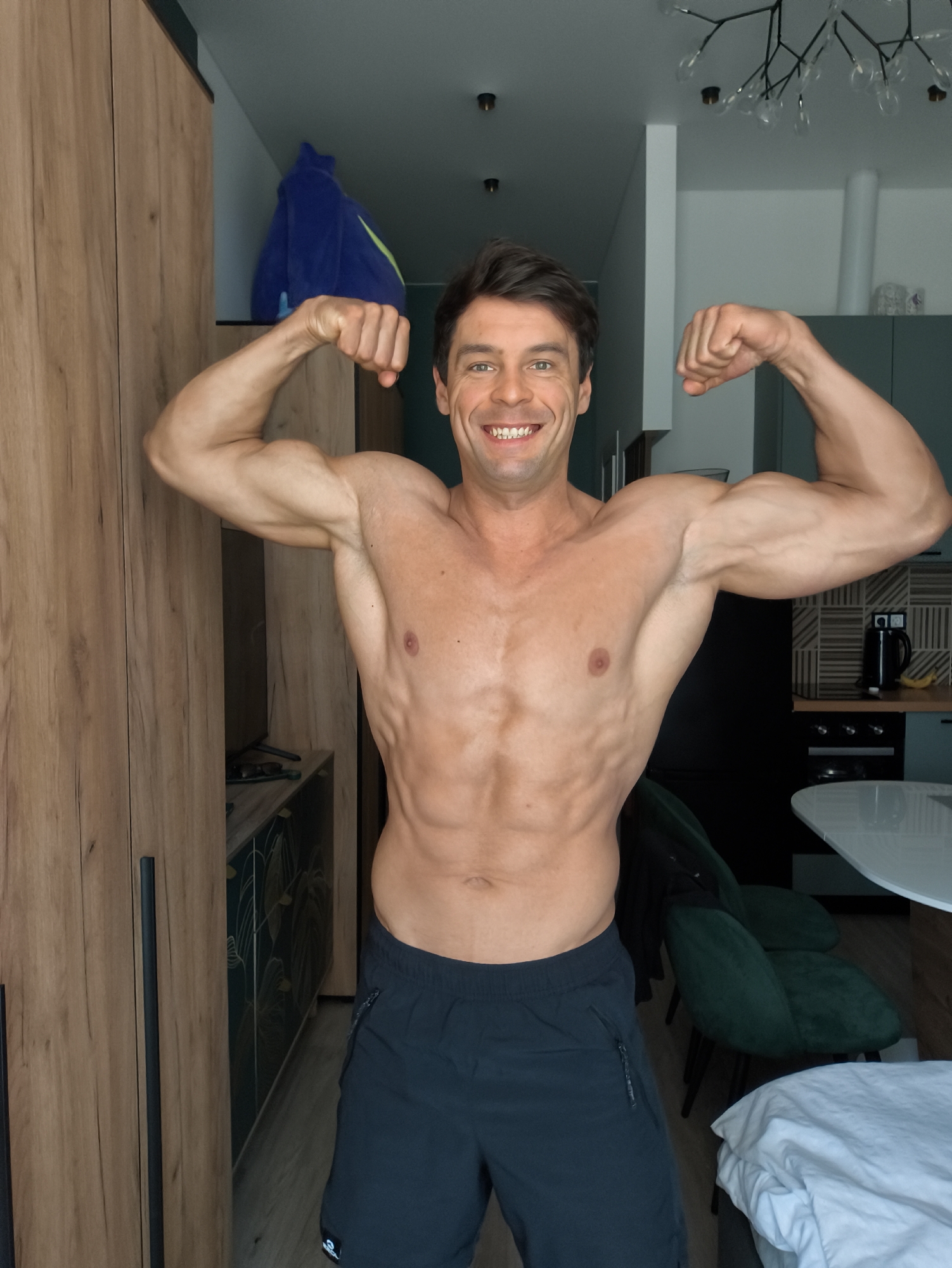 Shirtless man poses for photos in Moscow apartment