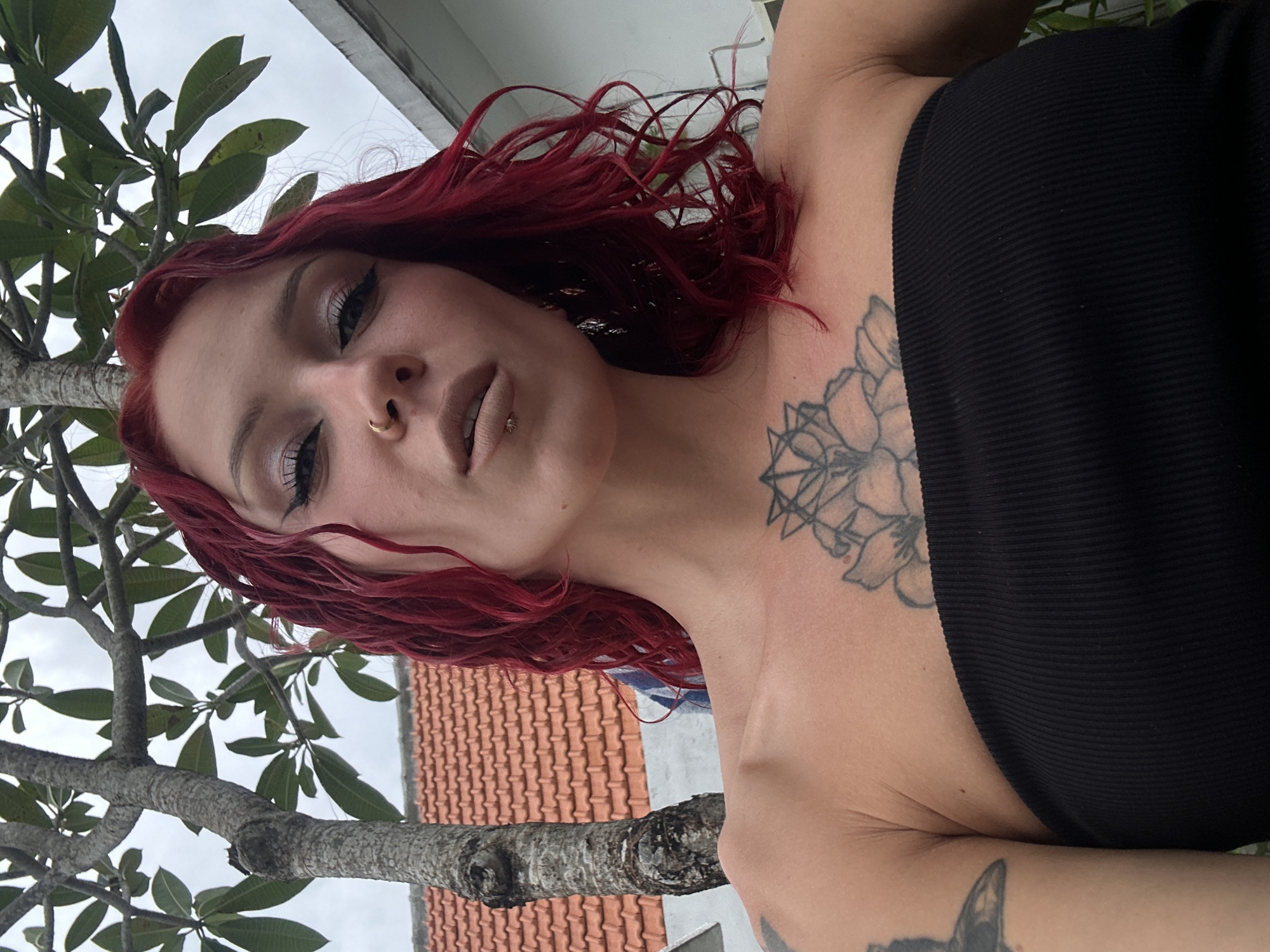 Red-haired woman photographed multiple times in North Kuta poolside