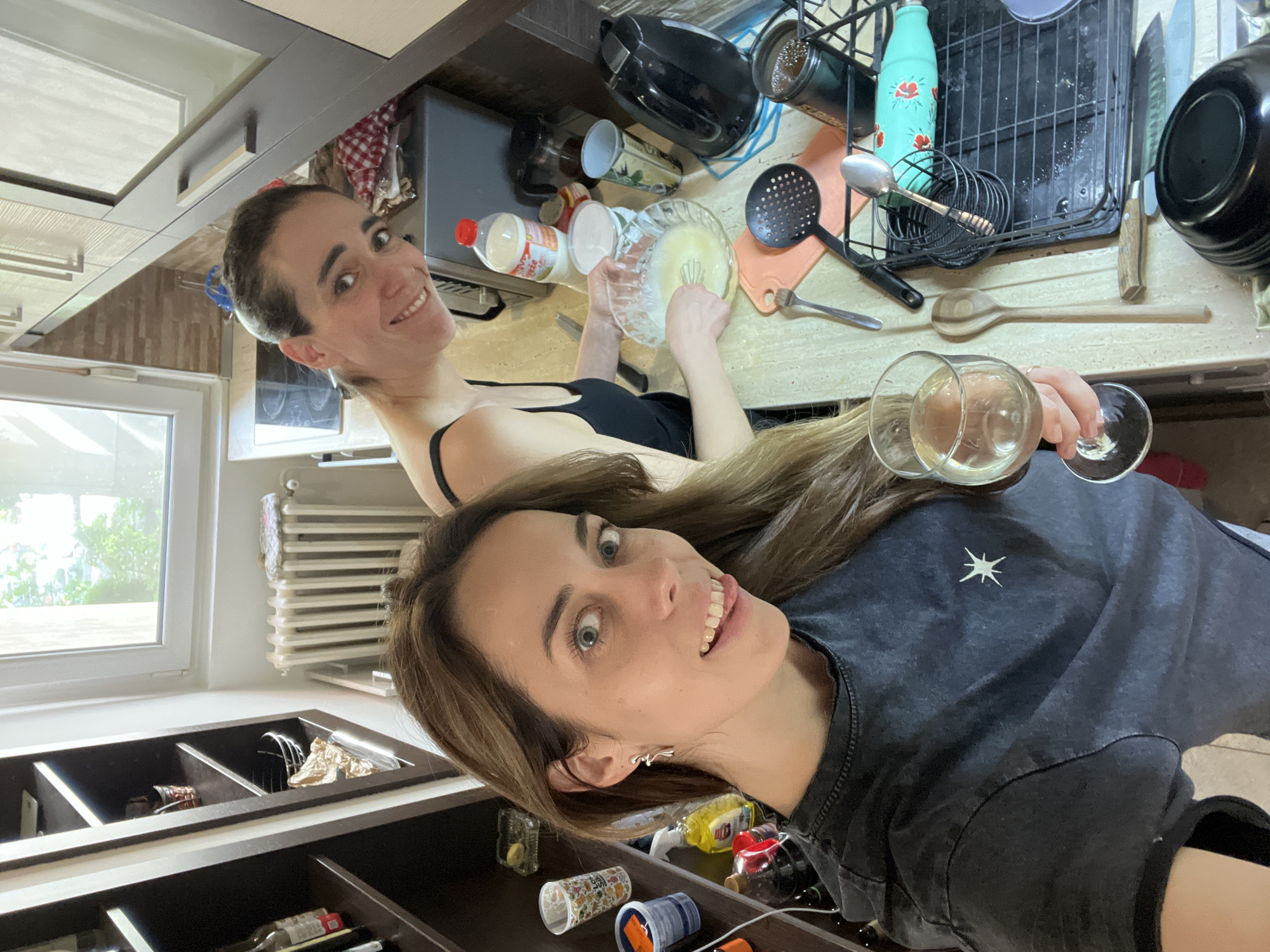 Women cooking and socializing in Belgrade area kitchen