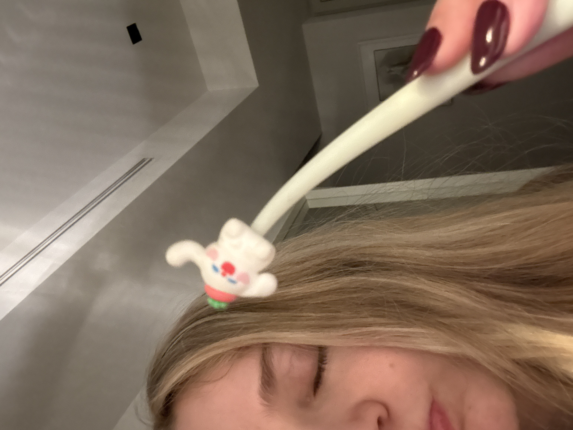 Late-night reader enjoys book with novelty rabbit pen in Mexico City