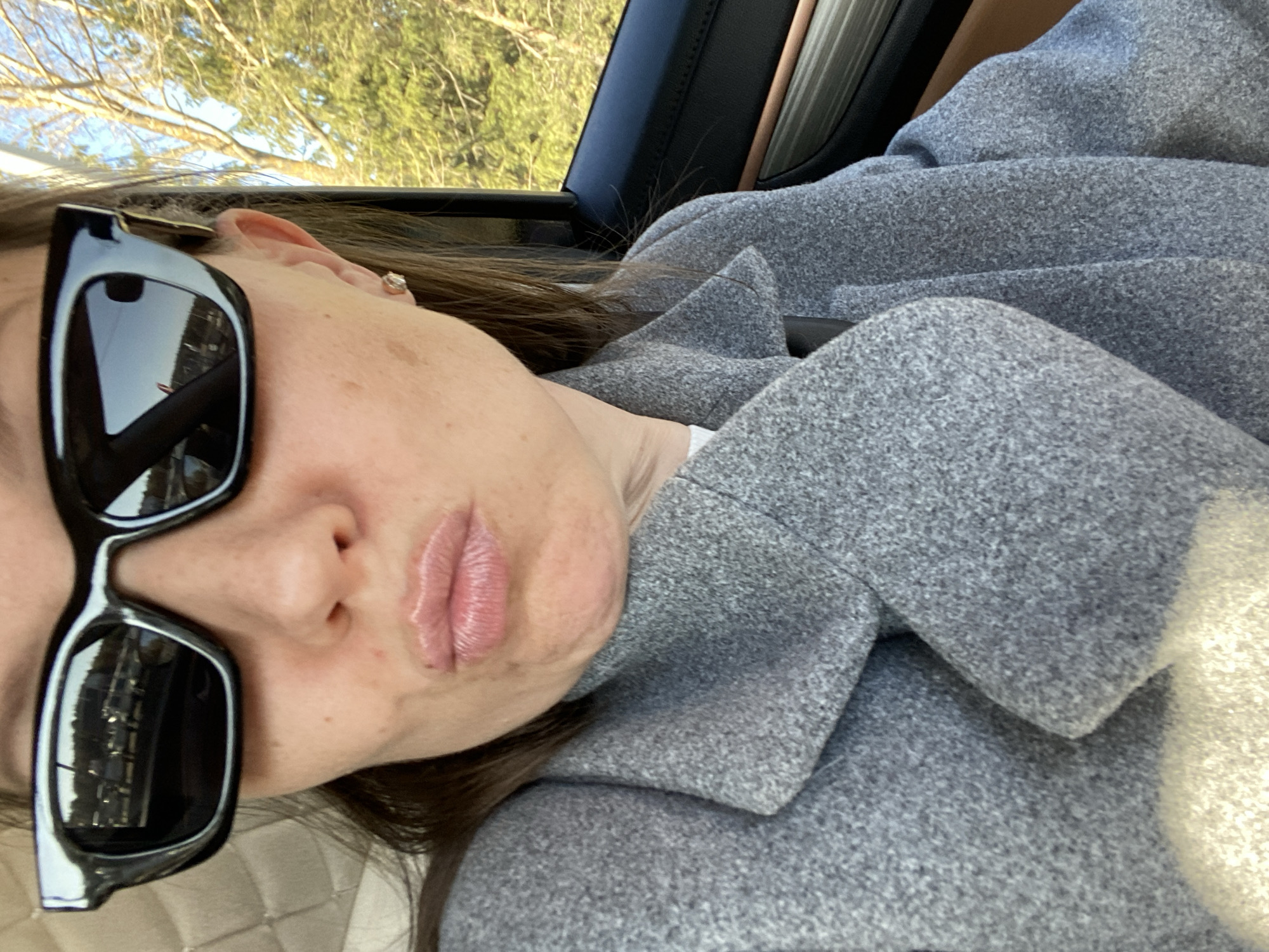 Woman in sunglasses spotted in car in Chaikovsky