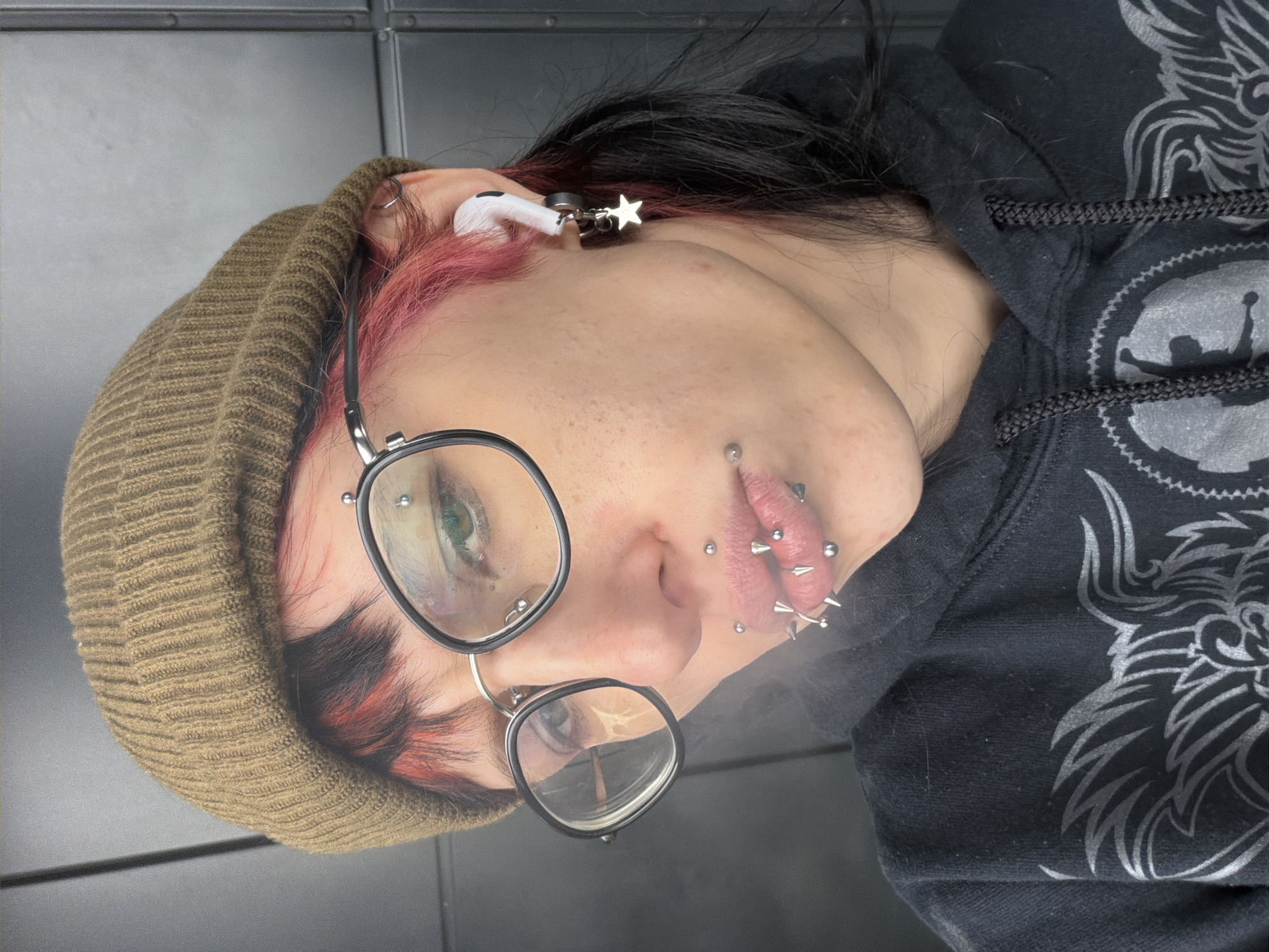 Portrait of heavily pierced individual captured in Sofia