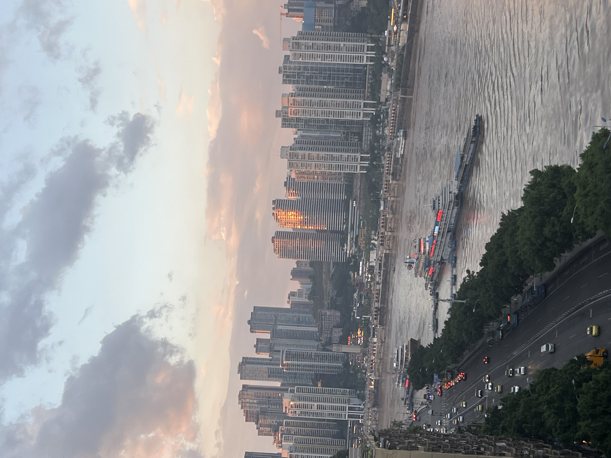 Chongqing's riverfront bridges and skyline at golden hour