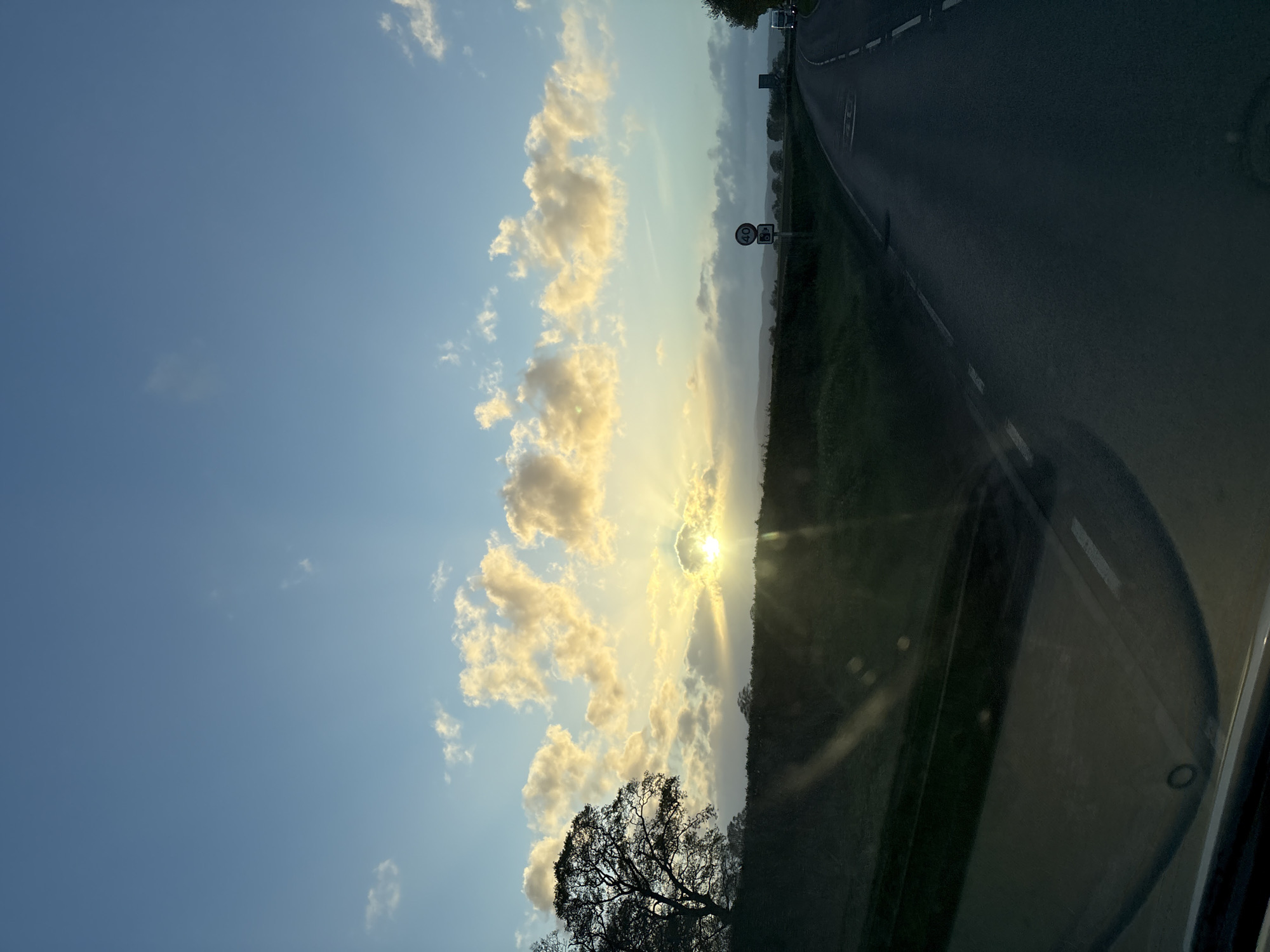 Evening sunlight observed on rural road near Ruyton-XI-Towns