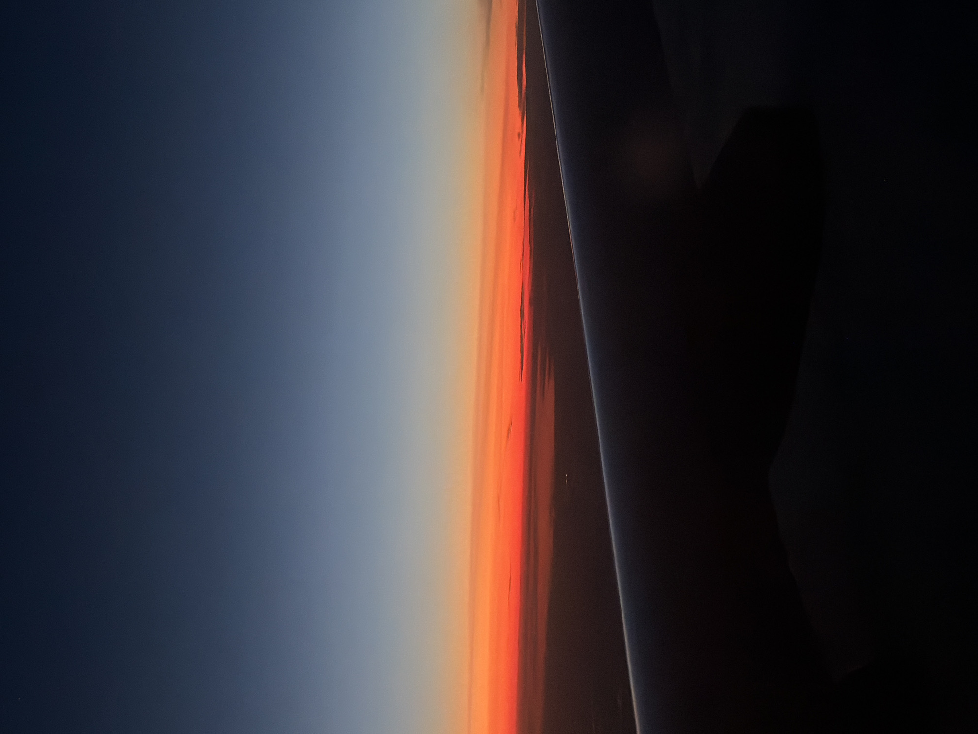 Woman documents airplane journey with selfies over Russia twilight