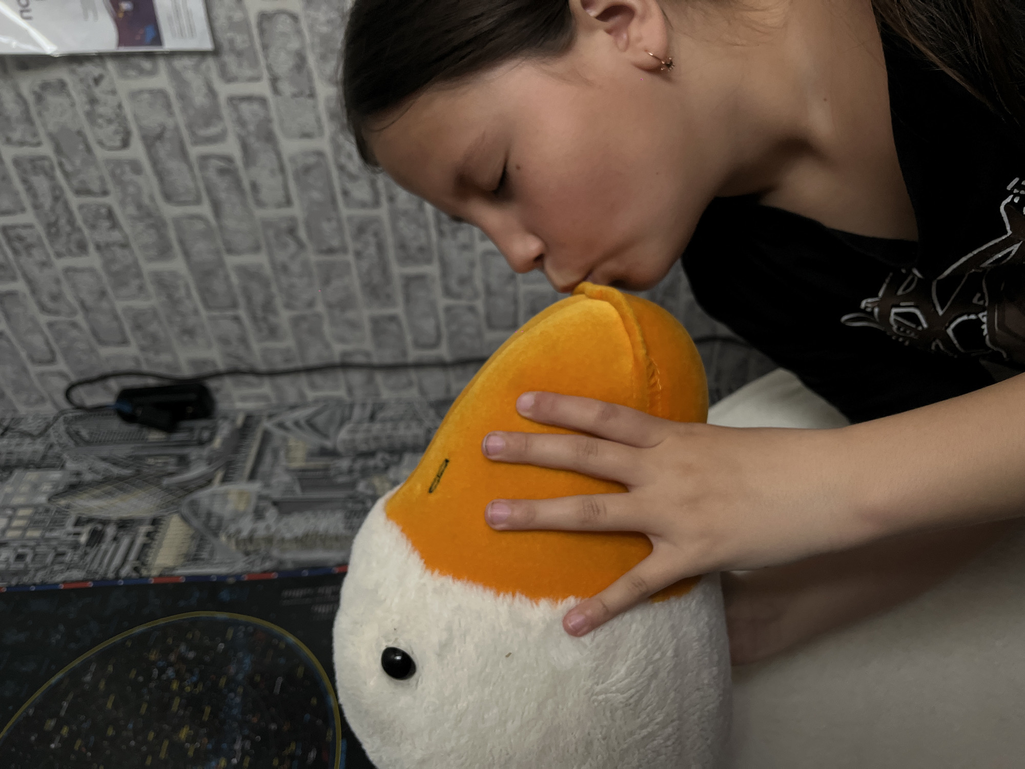 Children play with stuffed animals in Novopokrovskaya home