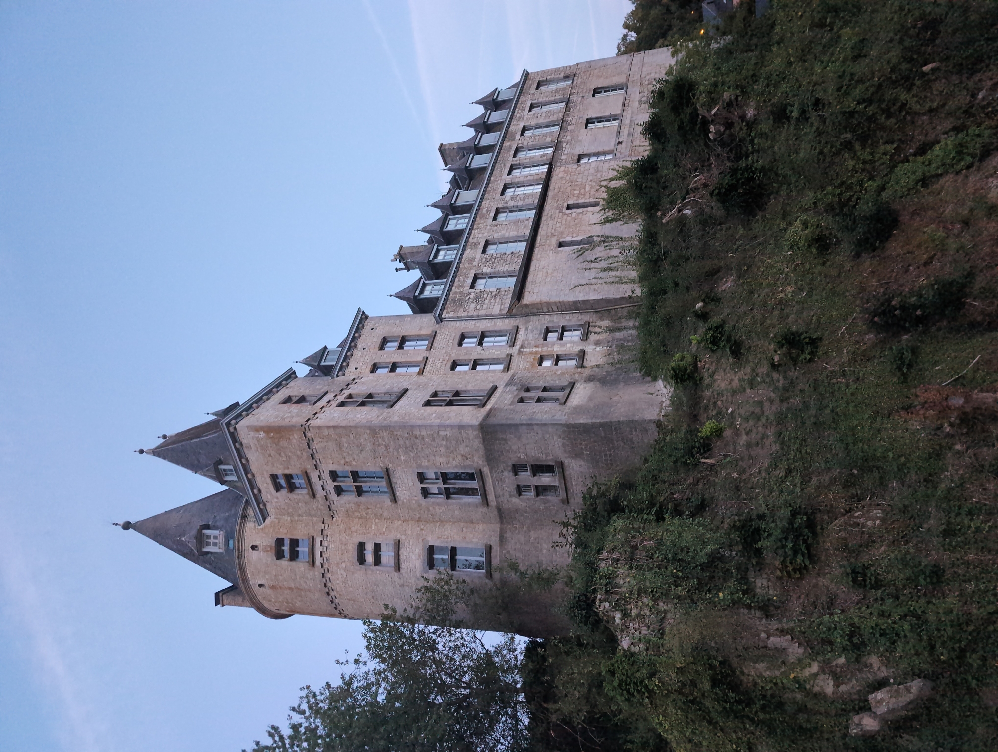 Medieval castle and riverside twilight scene, historic European setting