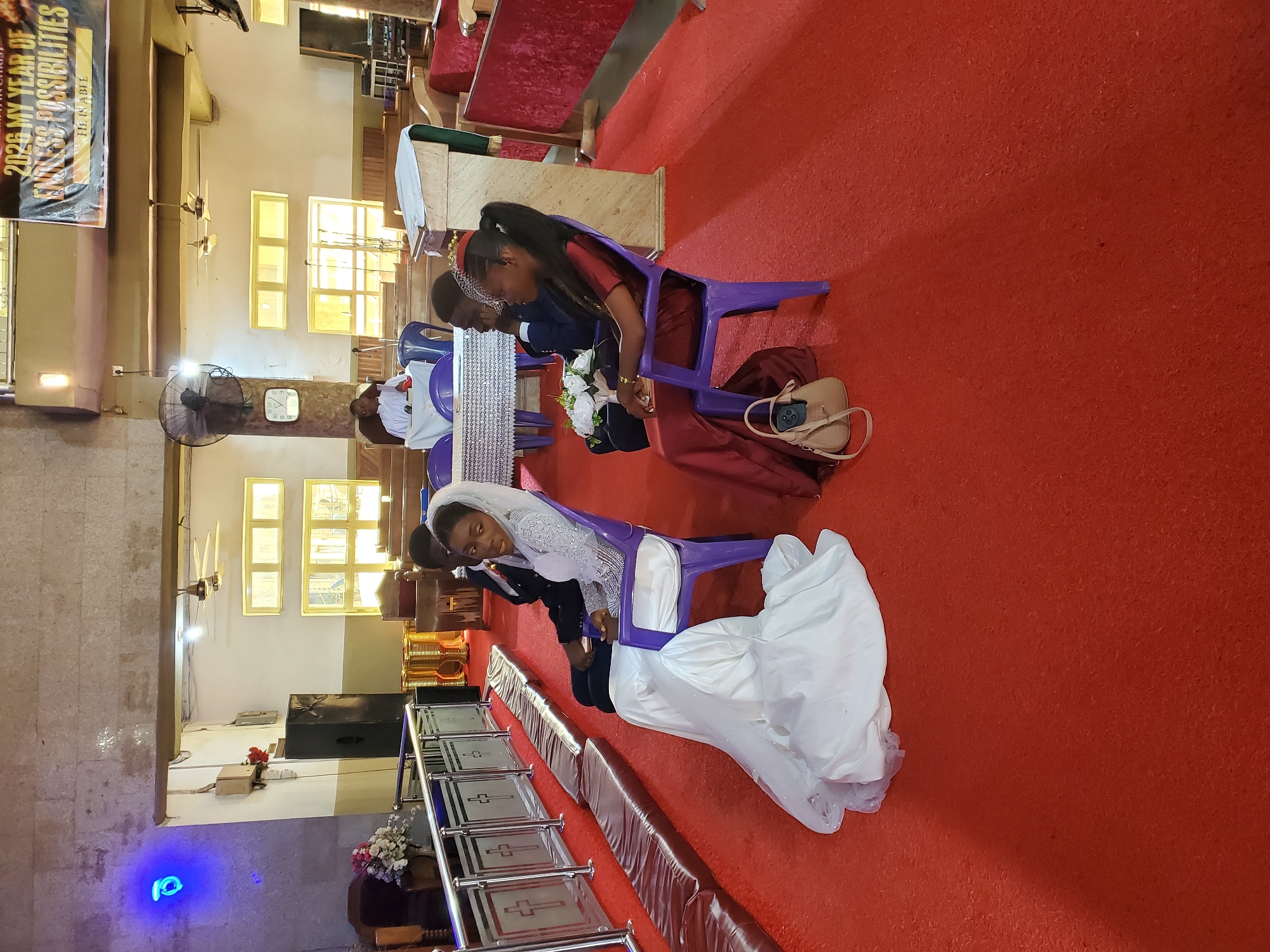 Wedding ceremony documented at Onitsha church with colorful attendees