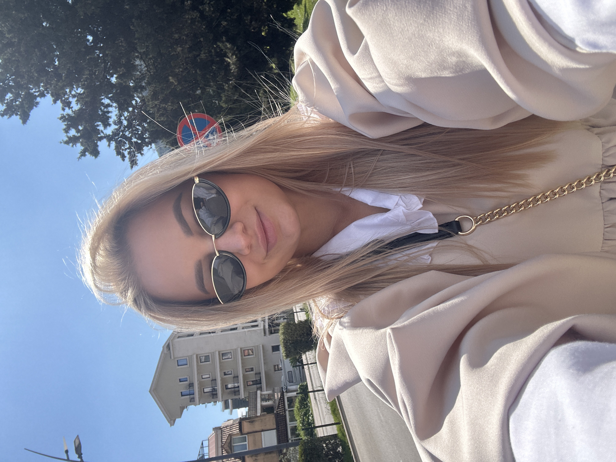 Woman enjoys spring afternoon among daisies in Budva