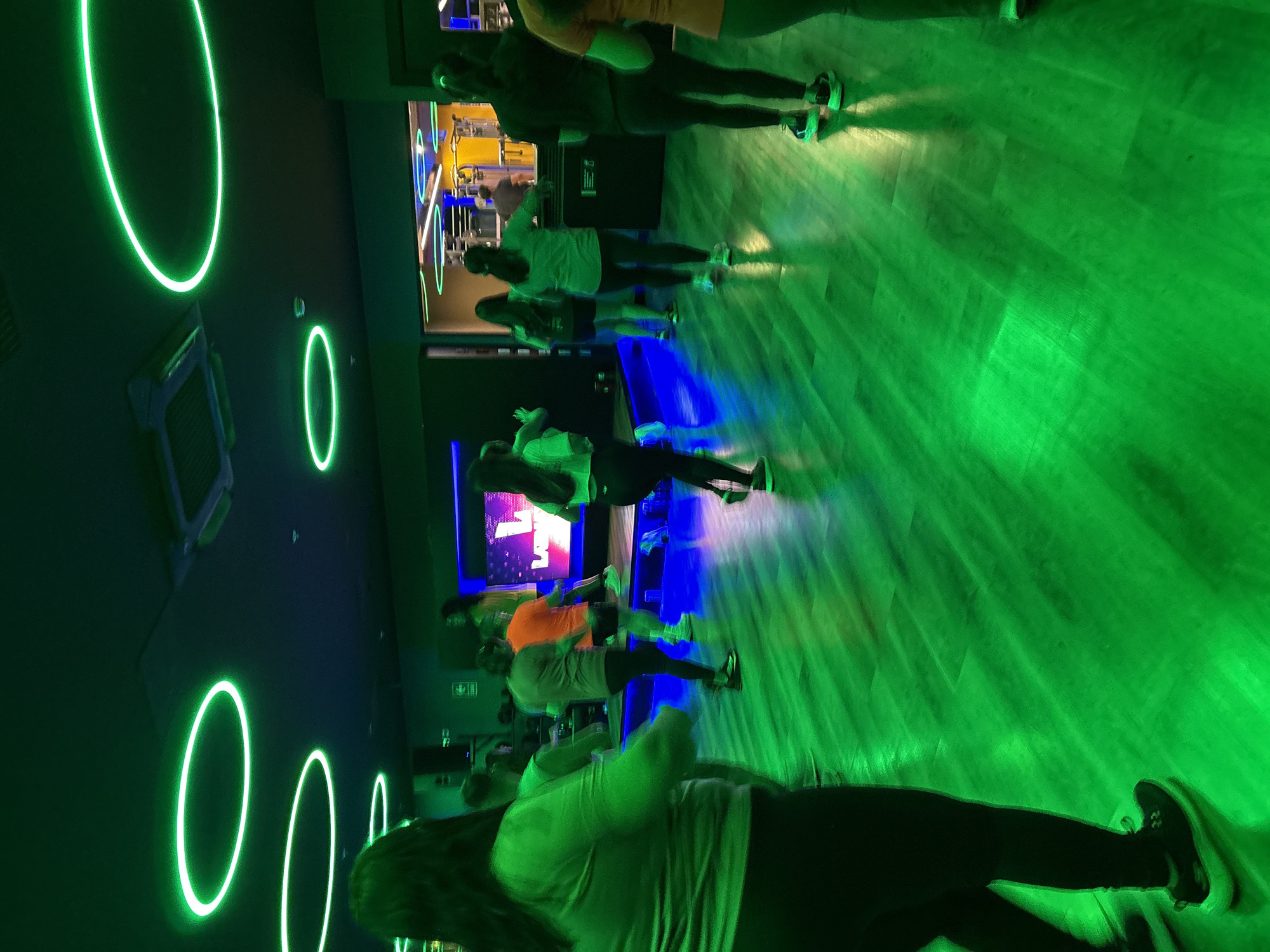 Dance fitness class at a neon-lit San Isidro gym