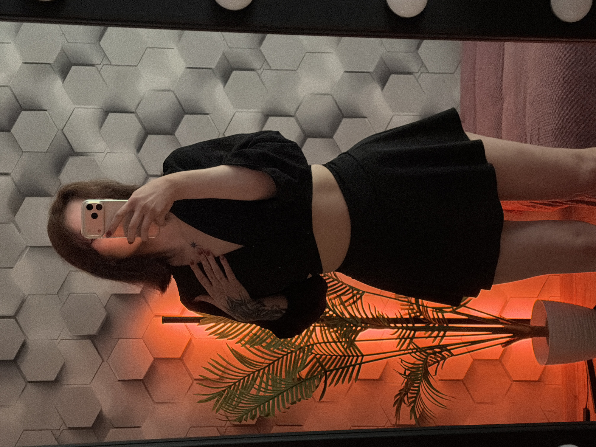 Person takes multiple selfies while gaming in decorated room