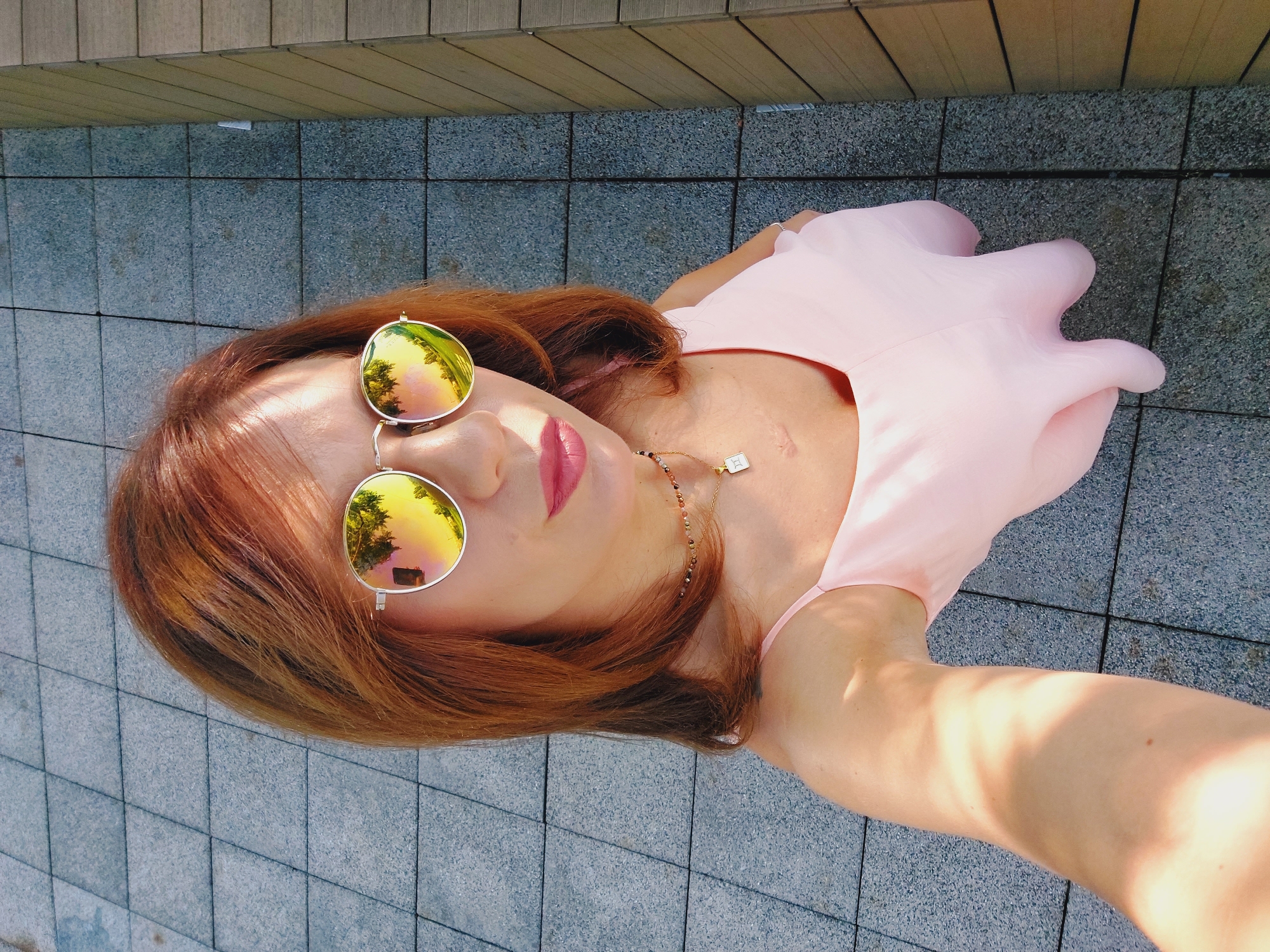 Rooftop selfie session in the sun, gold shades and pink.
