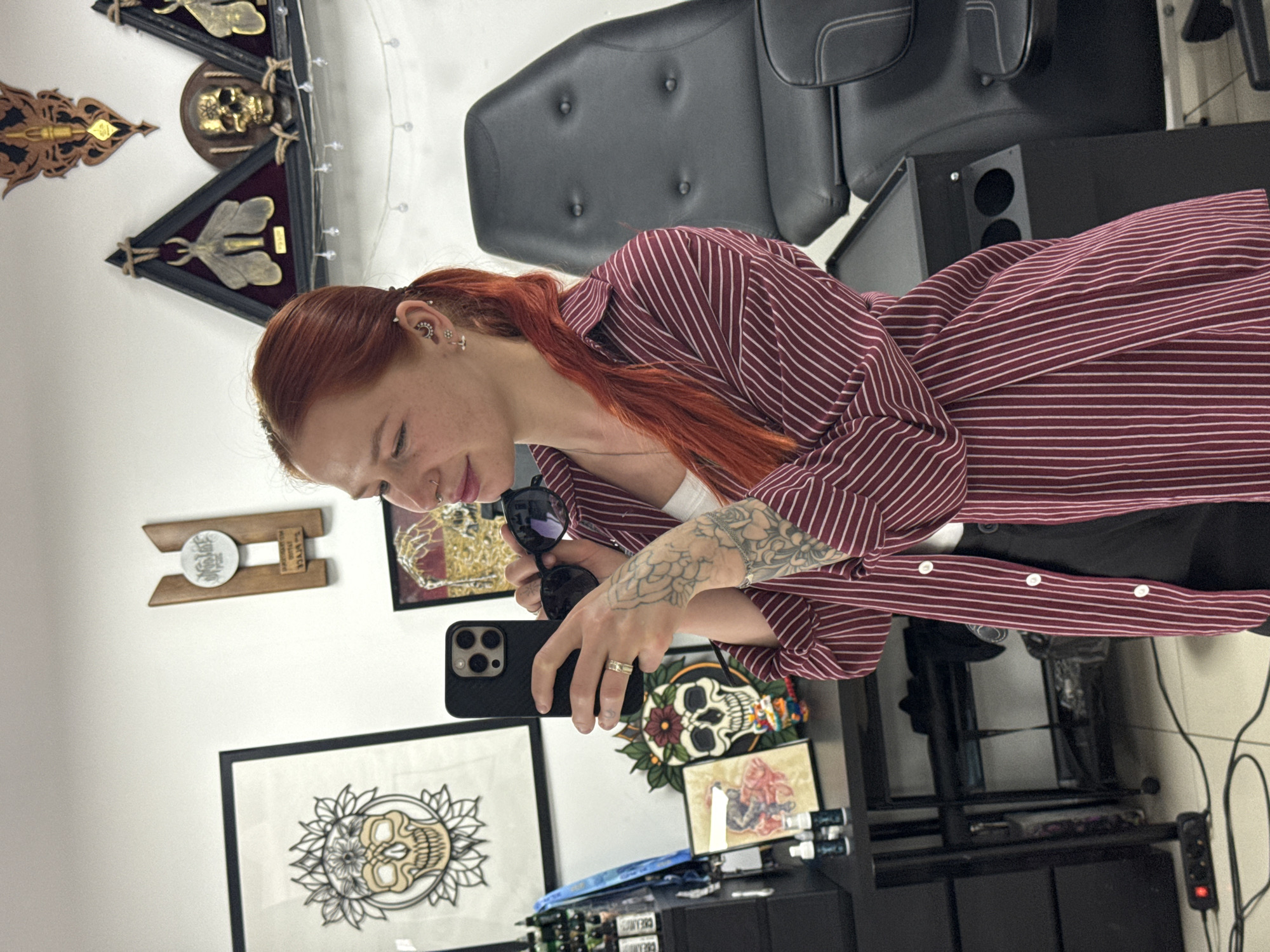 Woman documents tattoo session with selfies in Rostov-on-Don studio