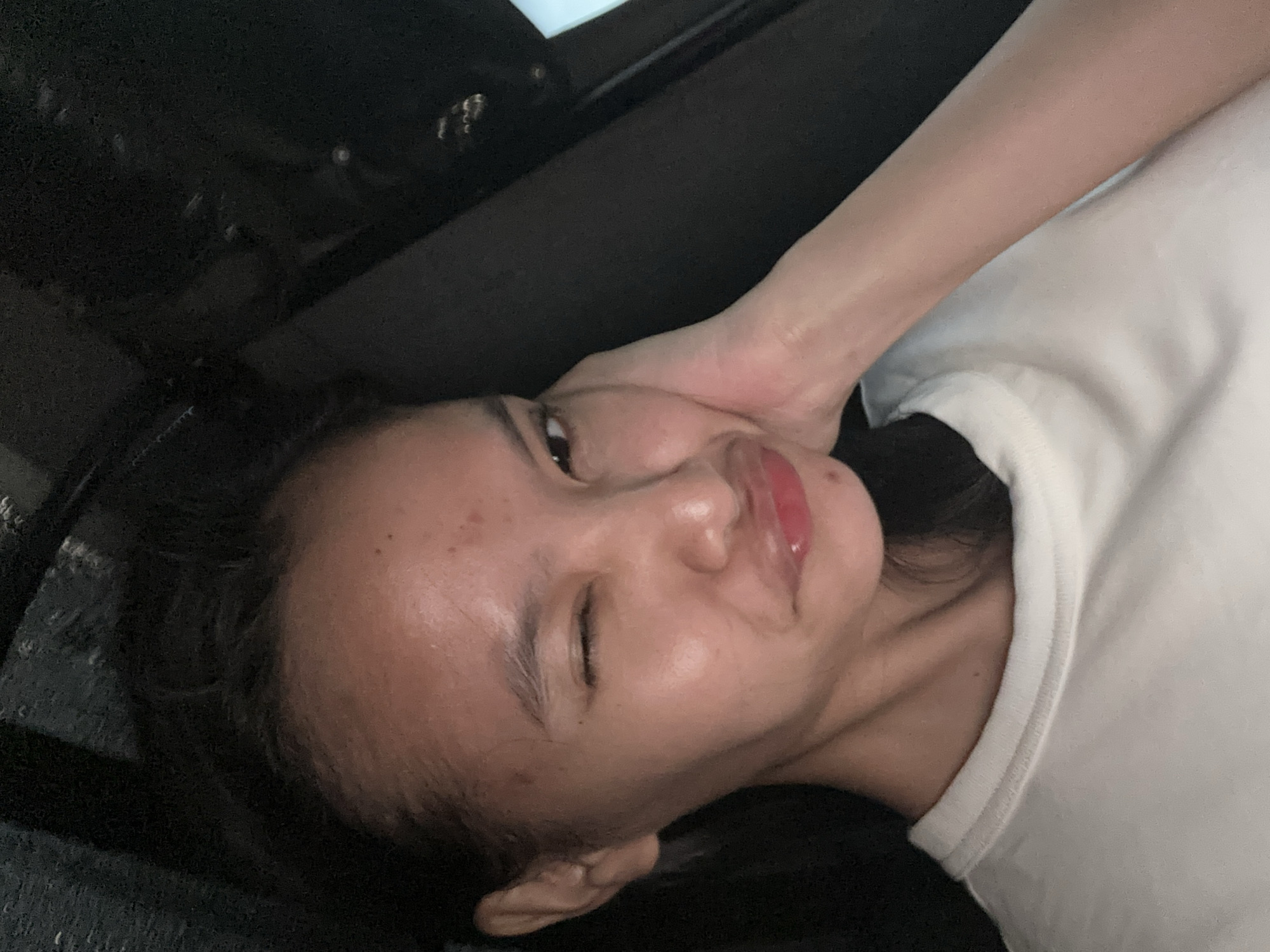 Woman takes selfies during evening drive through Davao City
