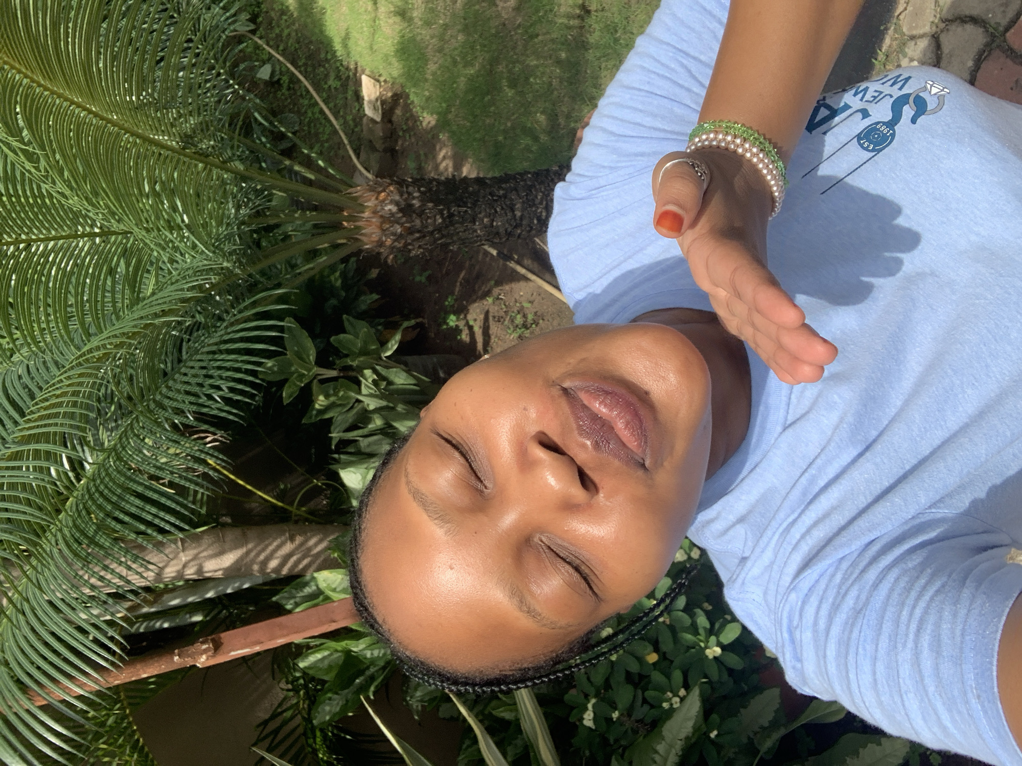 Woman observed resting outdoors in Dar es-Salaam morning