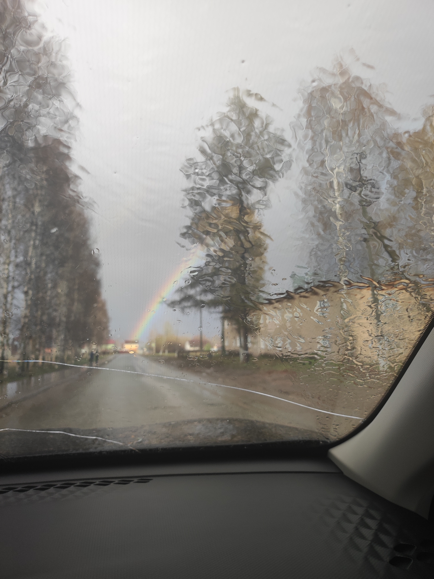Rainbow appears over wet street in Votkinsk after rain