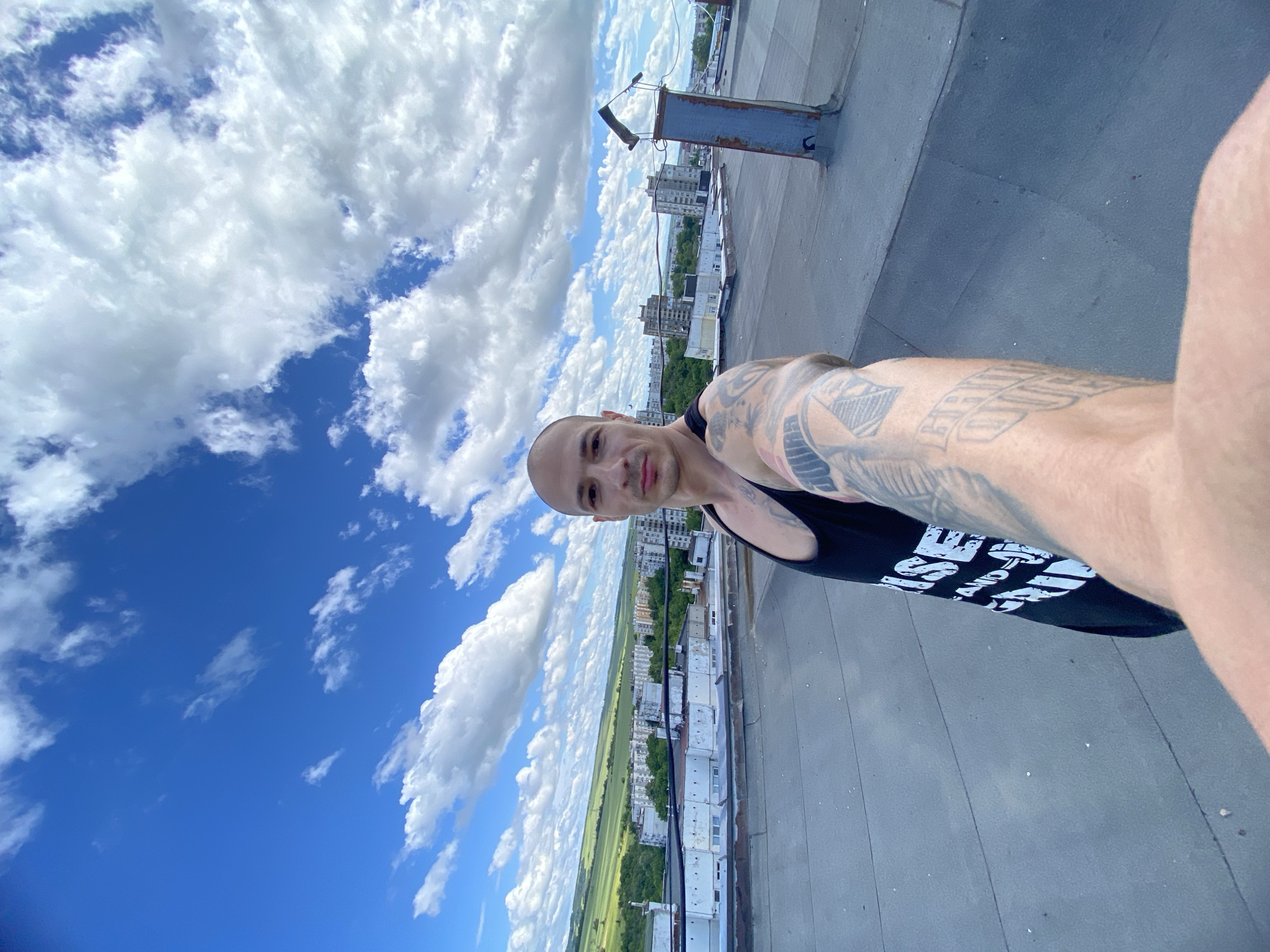 Person frames sky and landscape with black frame in Pleven