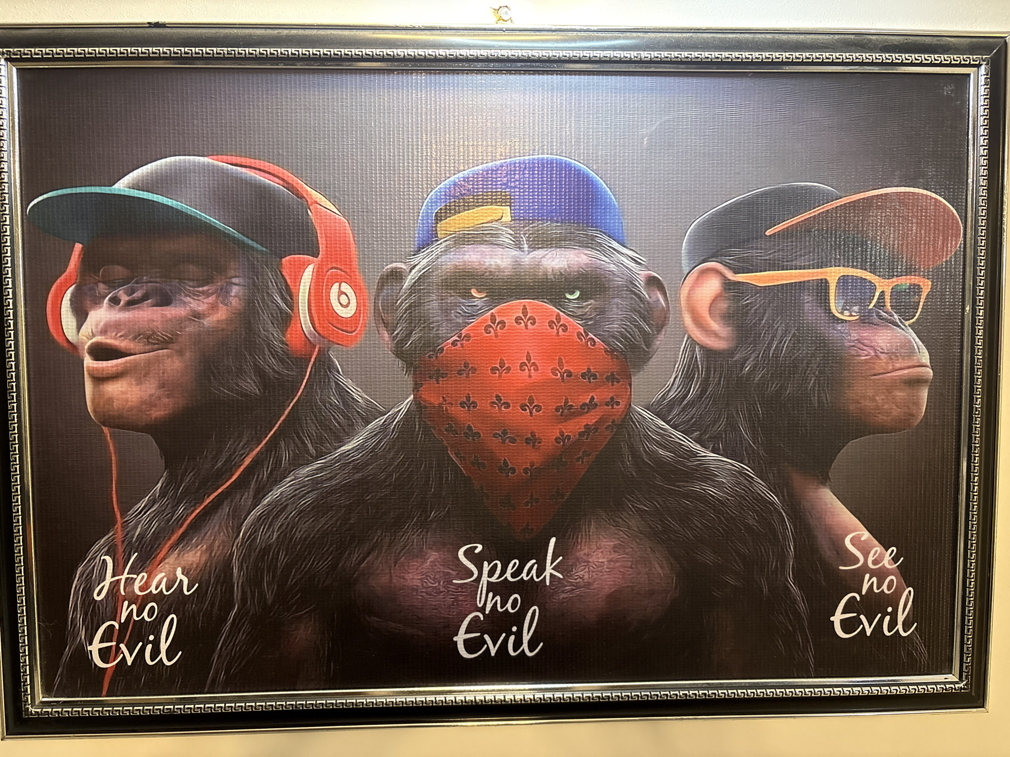 Two framed artworks — monkey proverb and fabric mosaic collage