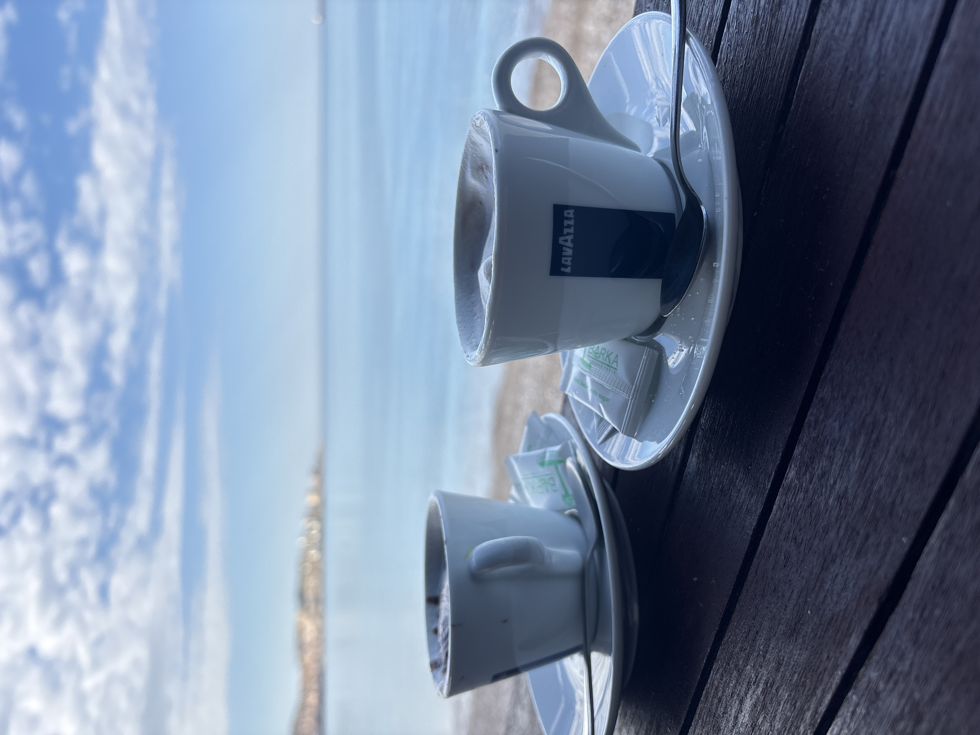 Morning coffee scene as small boat departs Bar Montenegro